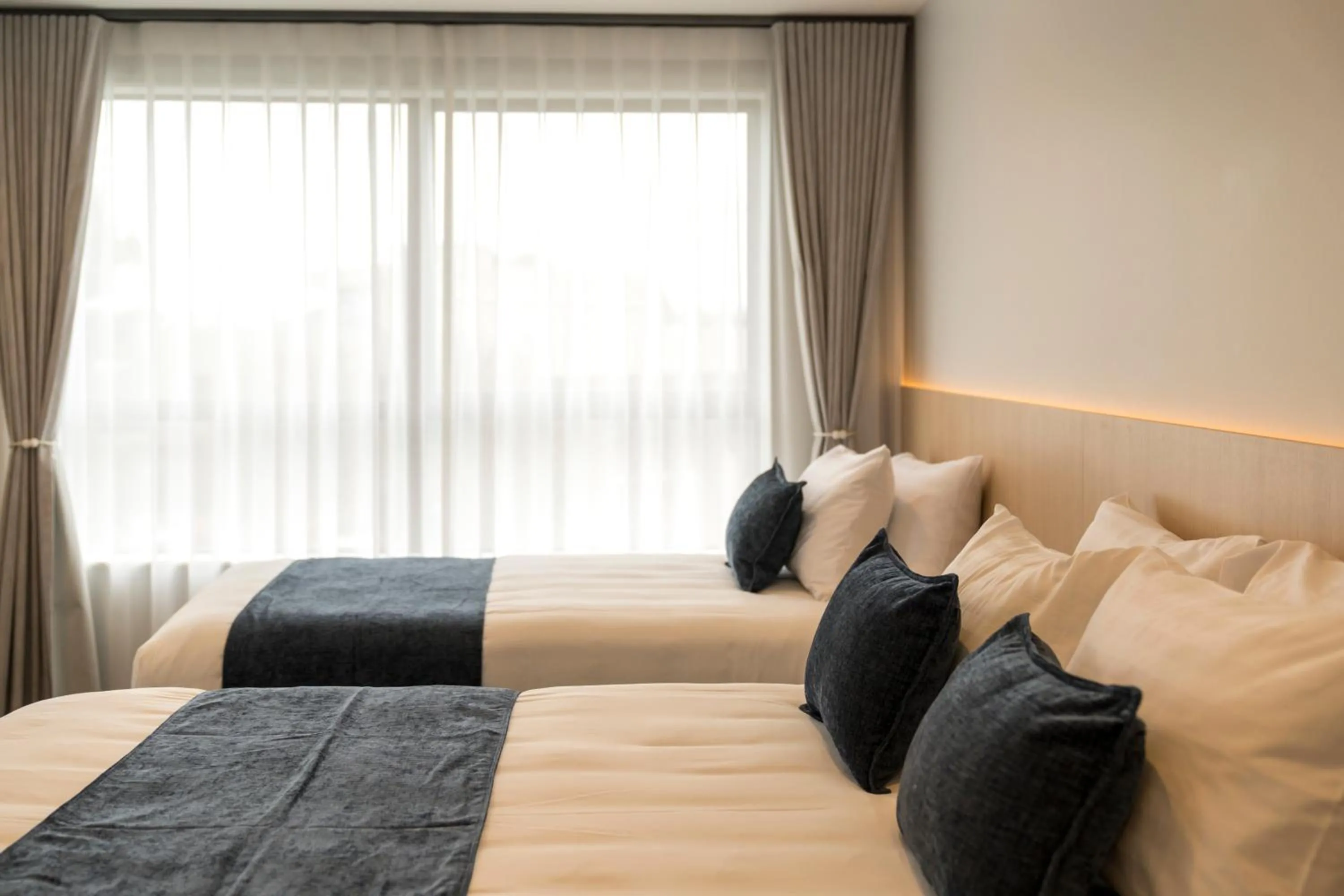 Bed in Takapuna International Motor Lodge