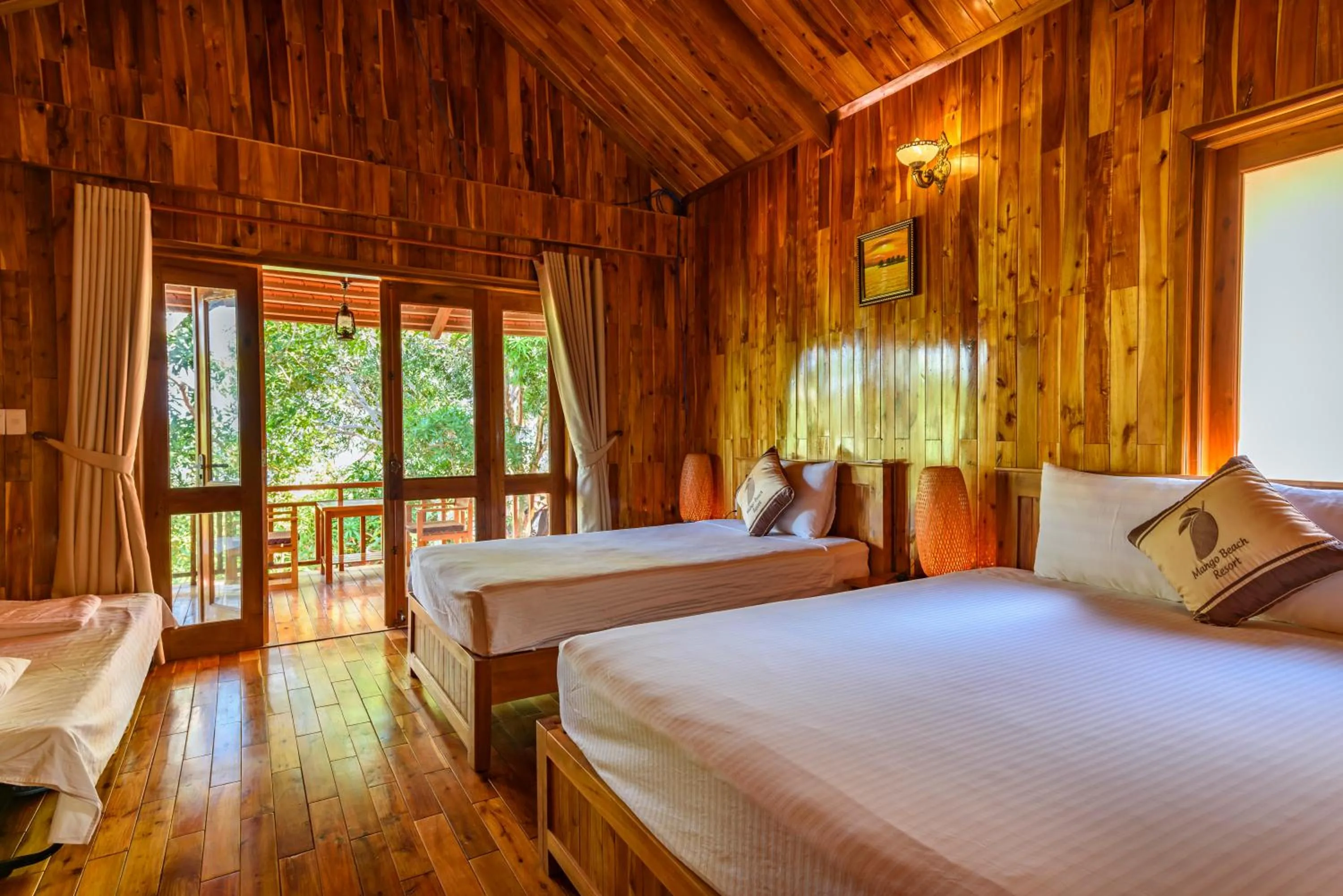 Bed in Mango Beach Resort