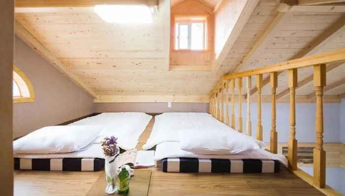 Bed in Red Windmill Pension