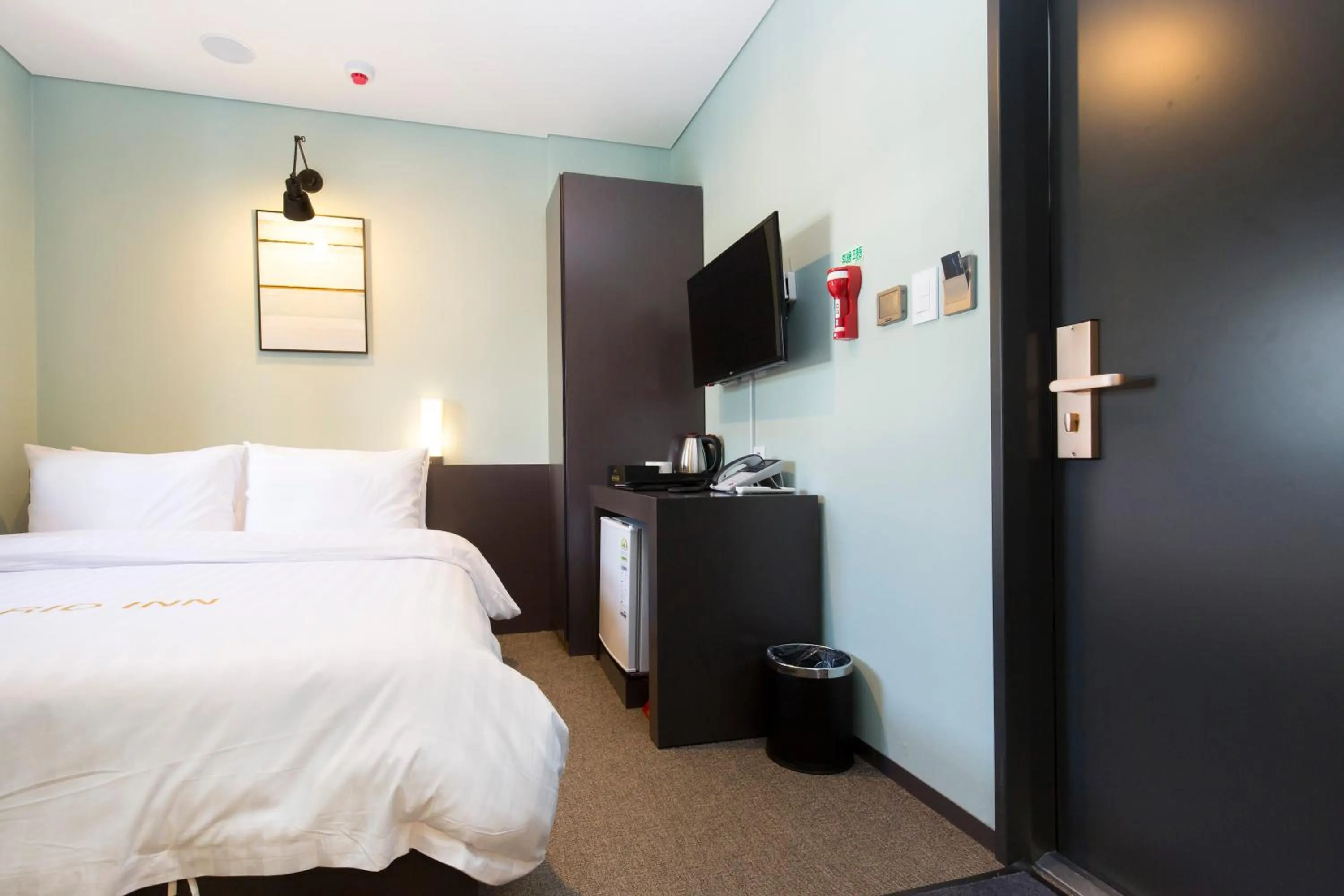 Decorative detail, Bed in Grid Inn Hotel