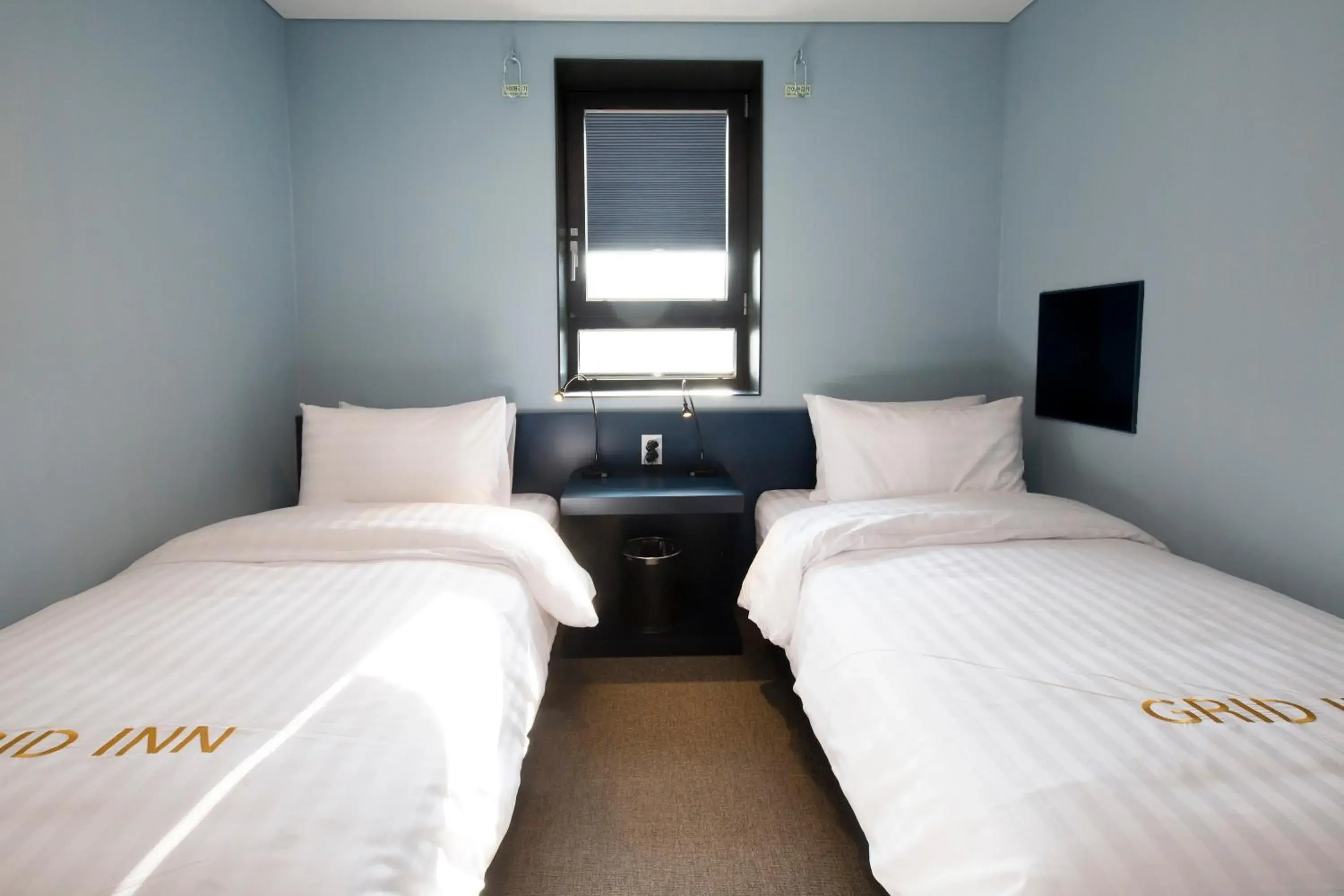 Twin Room in Grid Inn Hotel Twin Room in Grid Inn Hotel