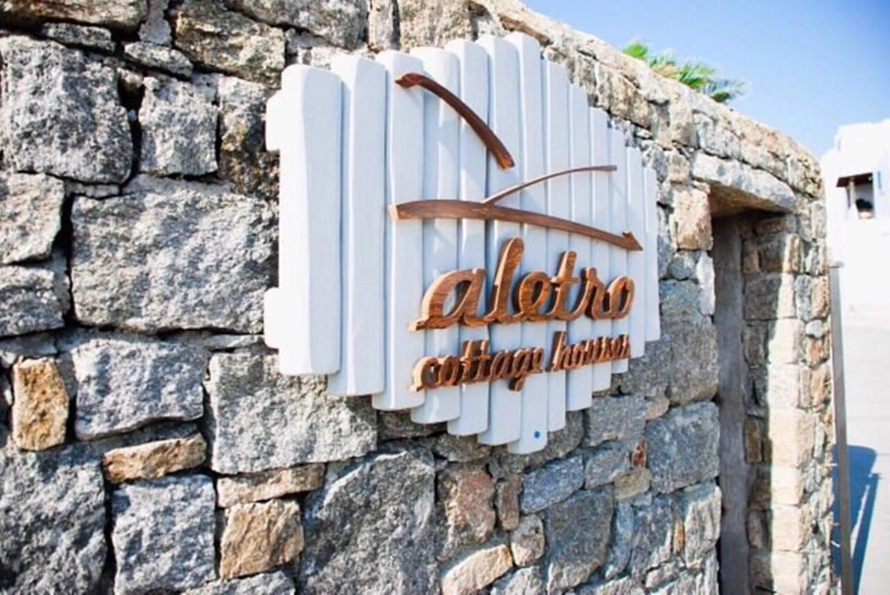 Property logo or sign in Aletro Cottage Houses