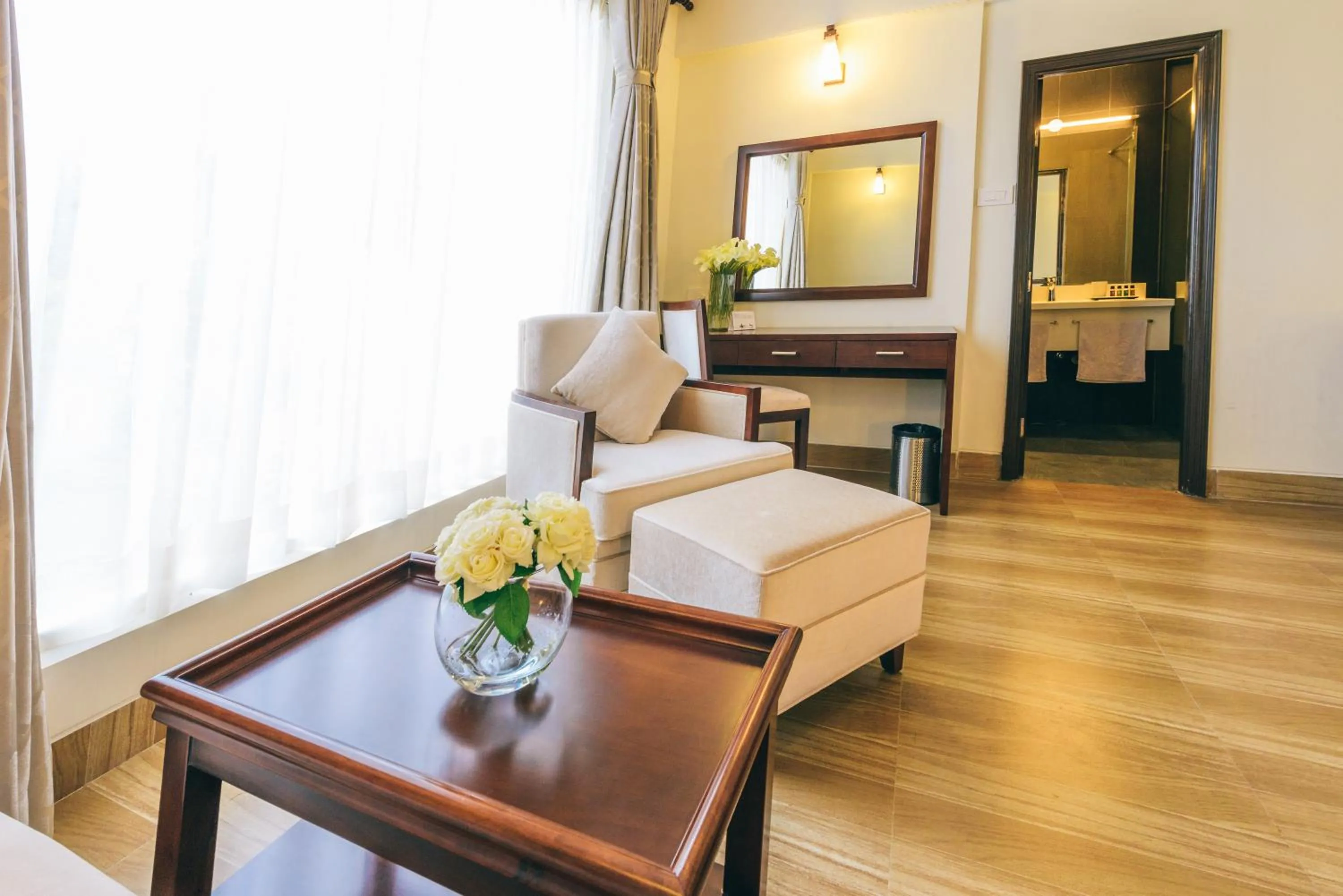 Seating area, Bed in The Greenfields Resort and Convention