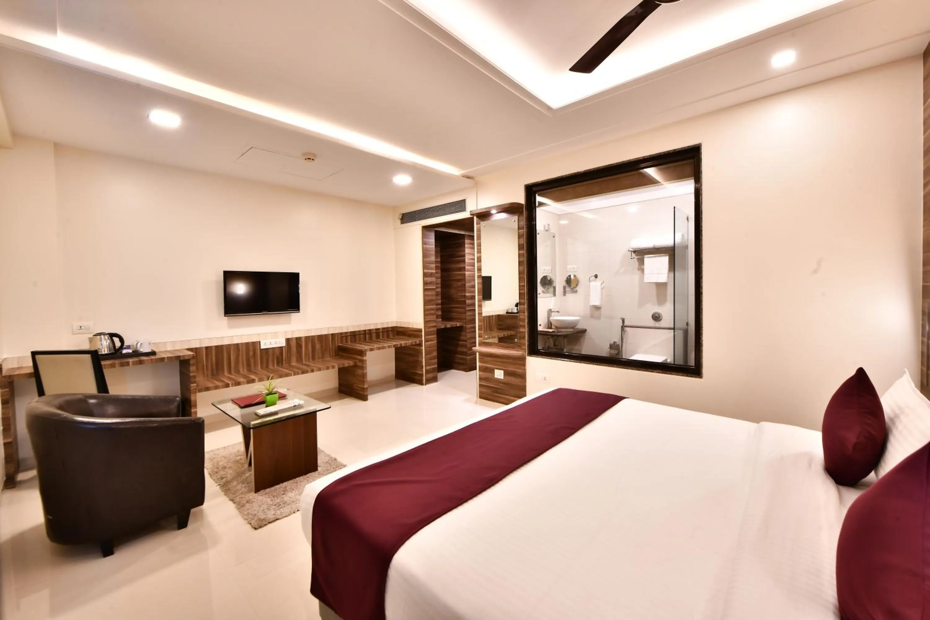 Photo of the whole room, Bed in Click Hotel Sagar Plaza Chakan, Pune