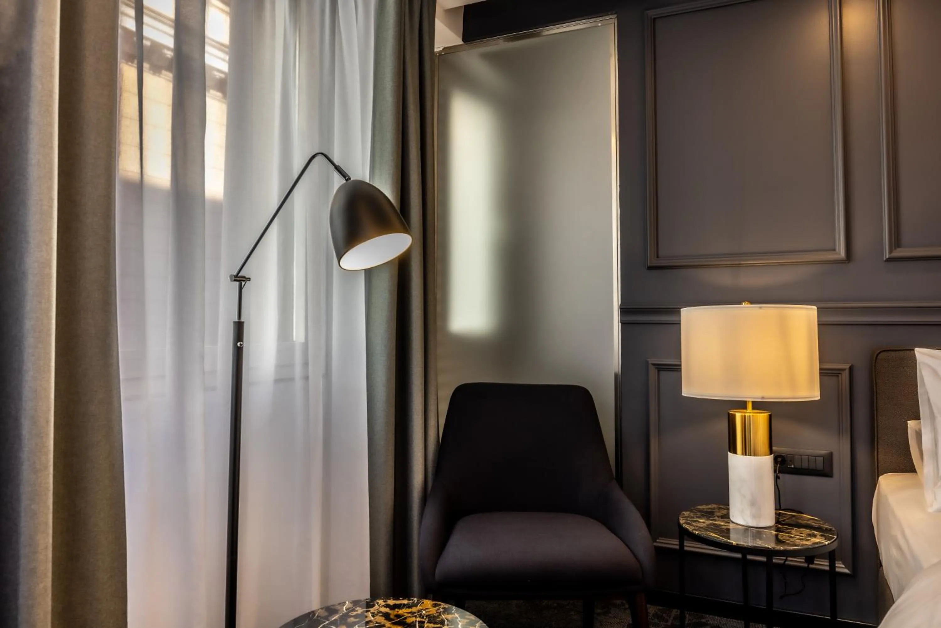 Seating area, Bed in Apeiro City Avant-garde Hotel