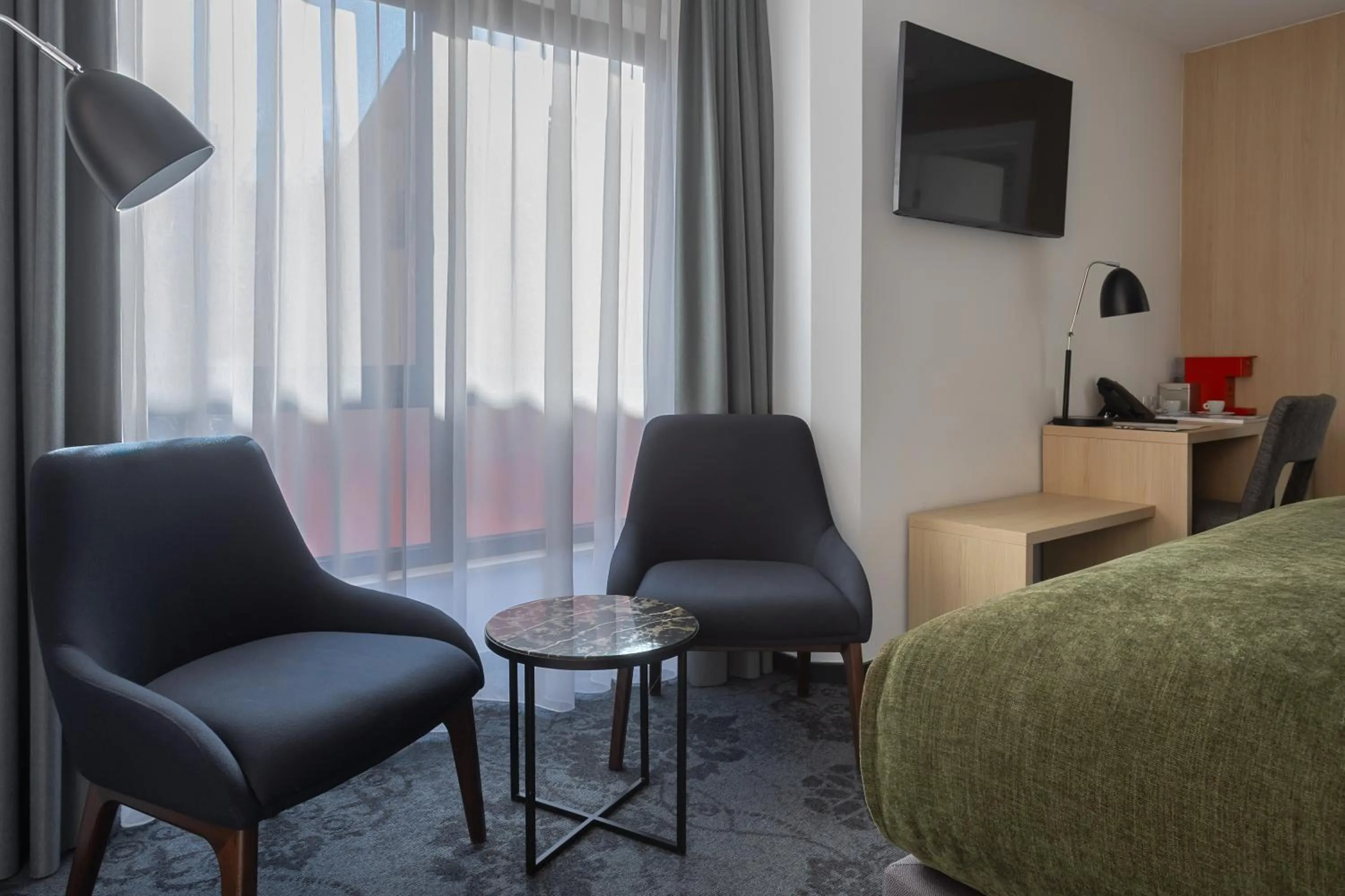 Seating area, Bed in Apeiro City Avant-garde Hotel