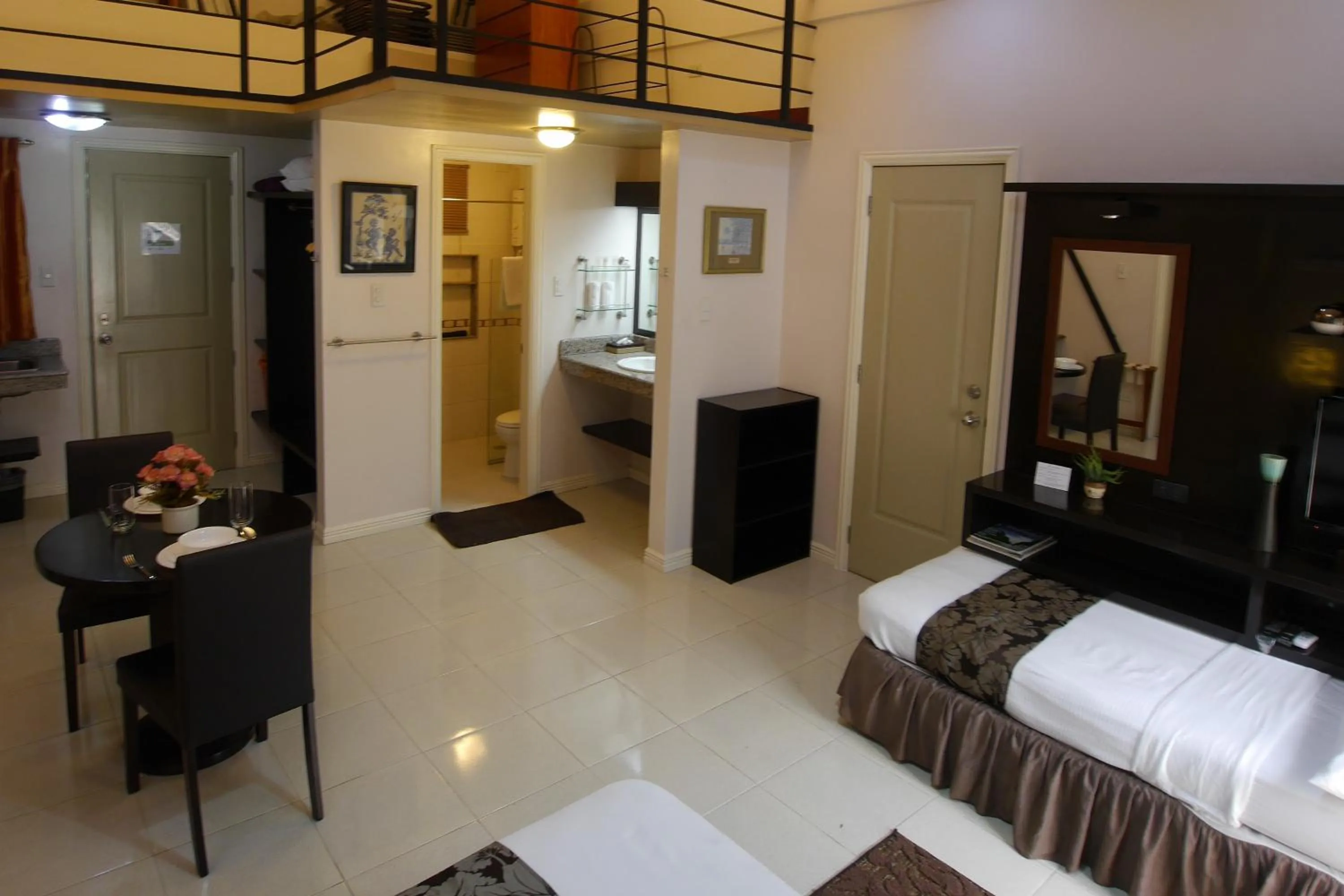 Photo of the whole room, Bed in New Manila Suites