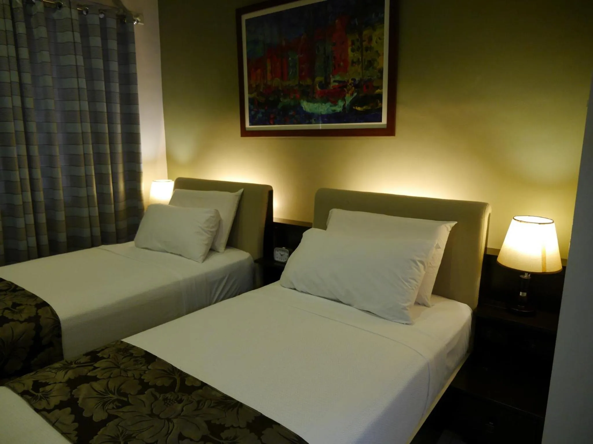 Bed in New Manila Suites