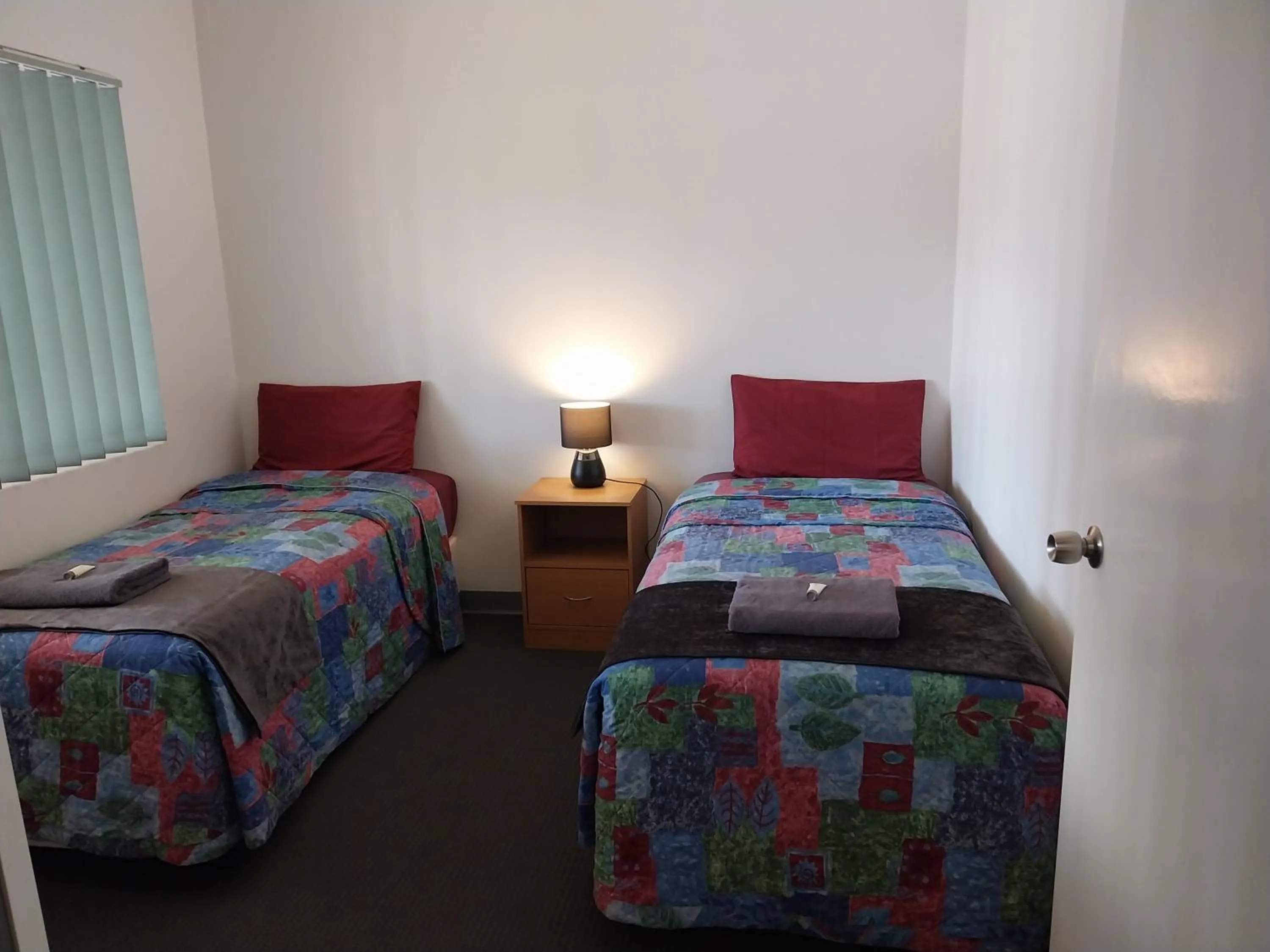 Bed in Carnarvon Central Apartments