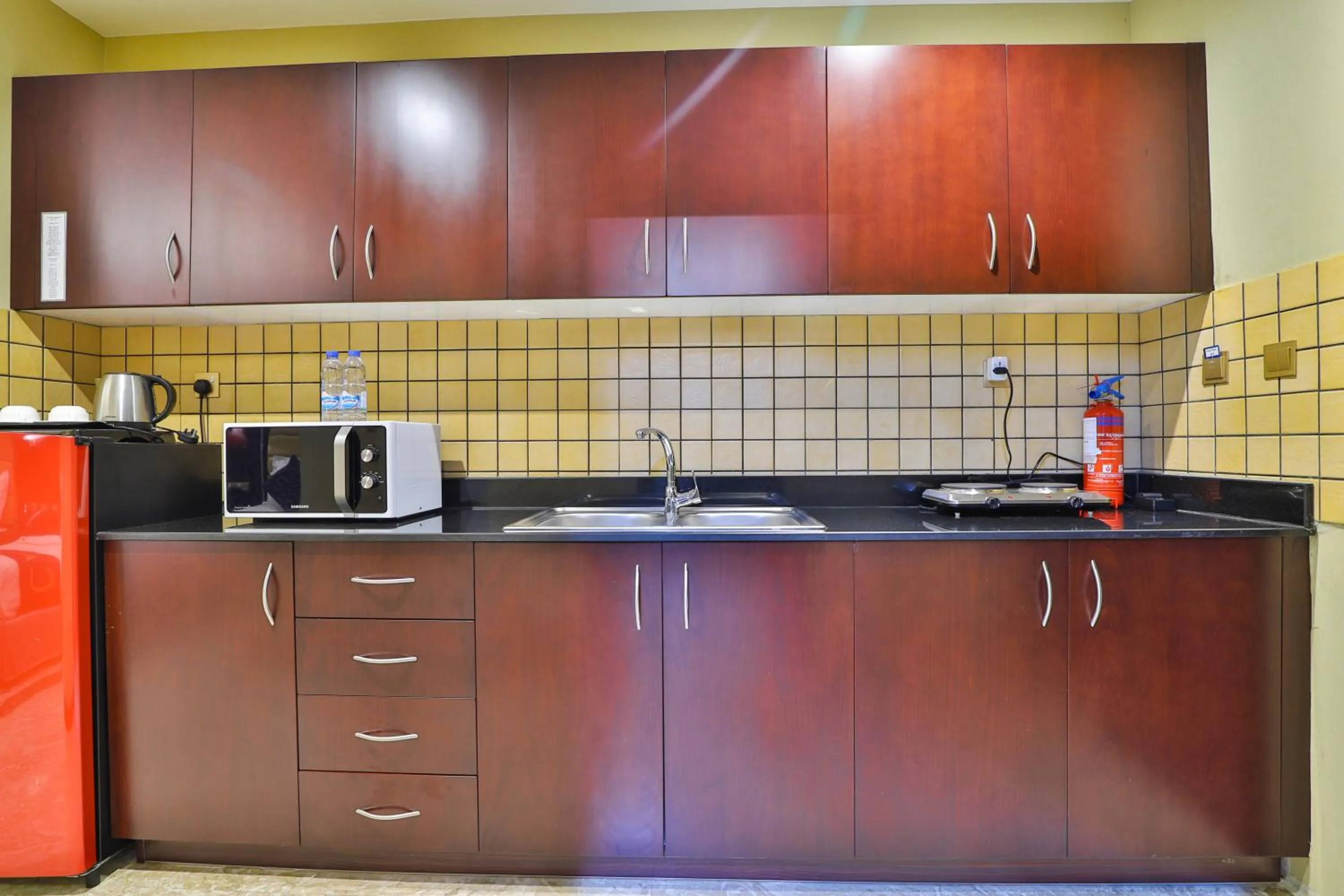 Kitchen or kitchenette in Telal Hotel Apartments