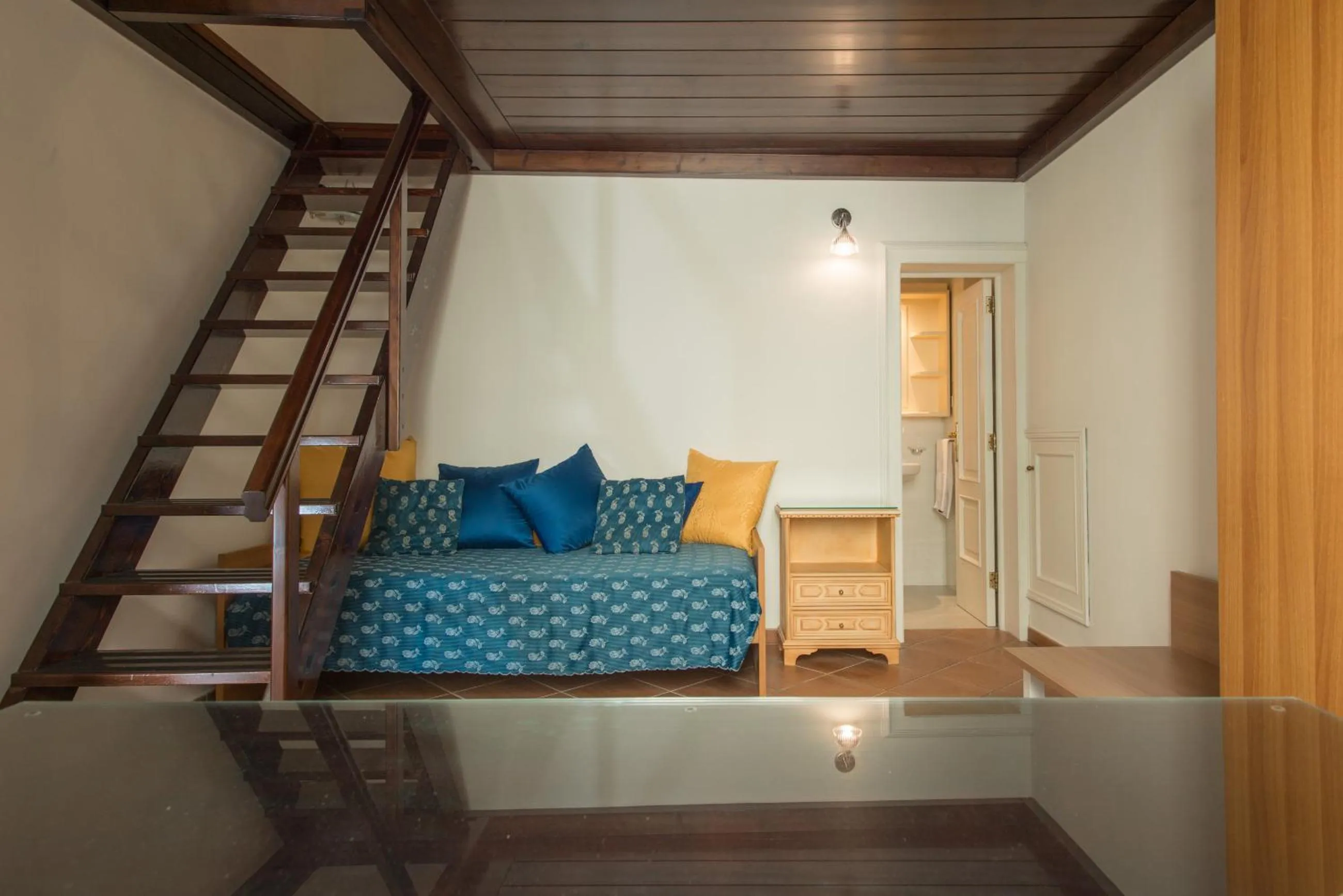 Bed in Il Garbino Suite and Apartment