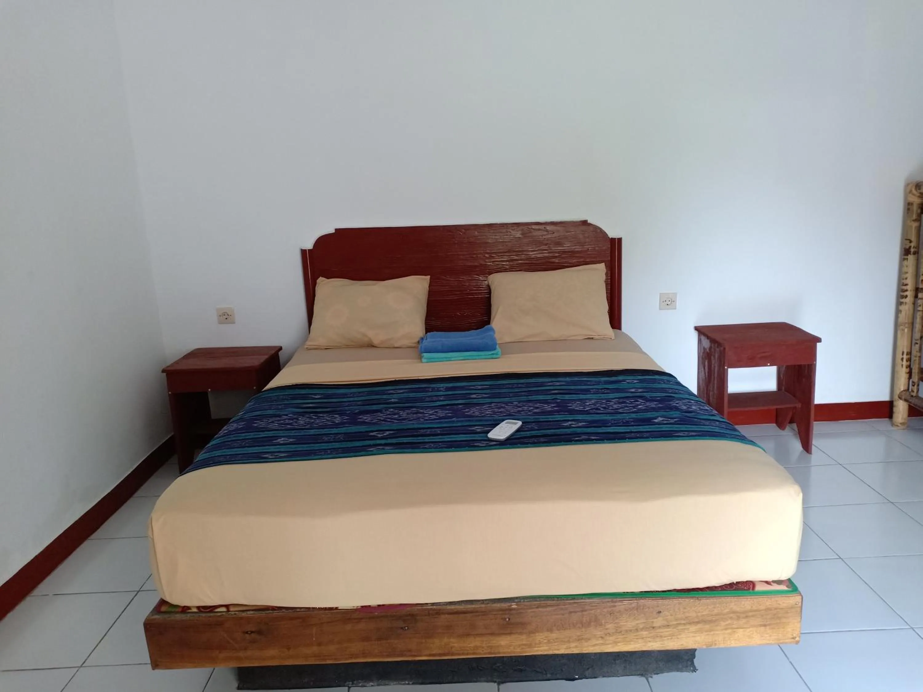 Bed in Dewi Garden Guesthouse
