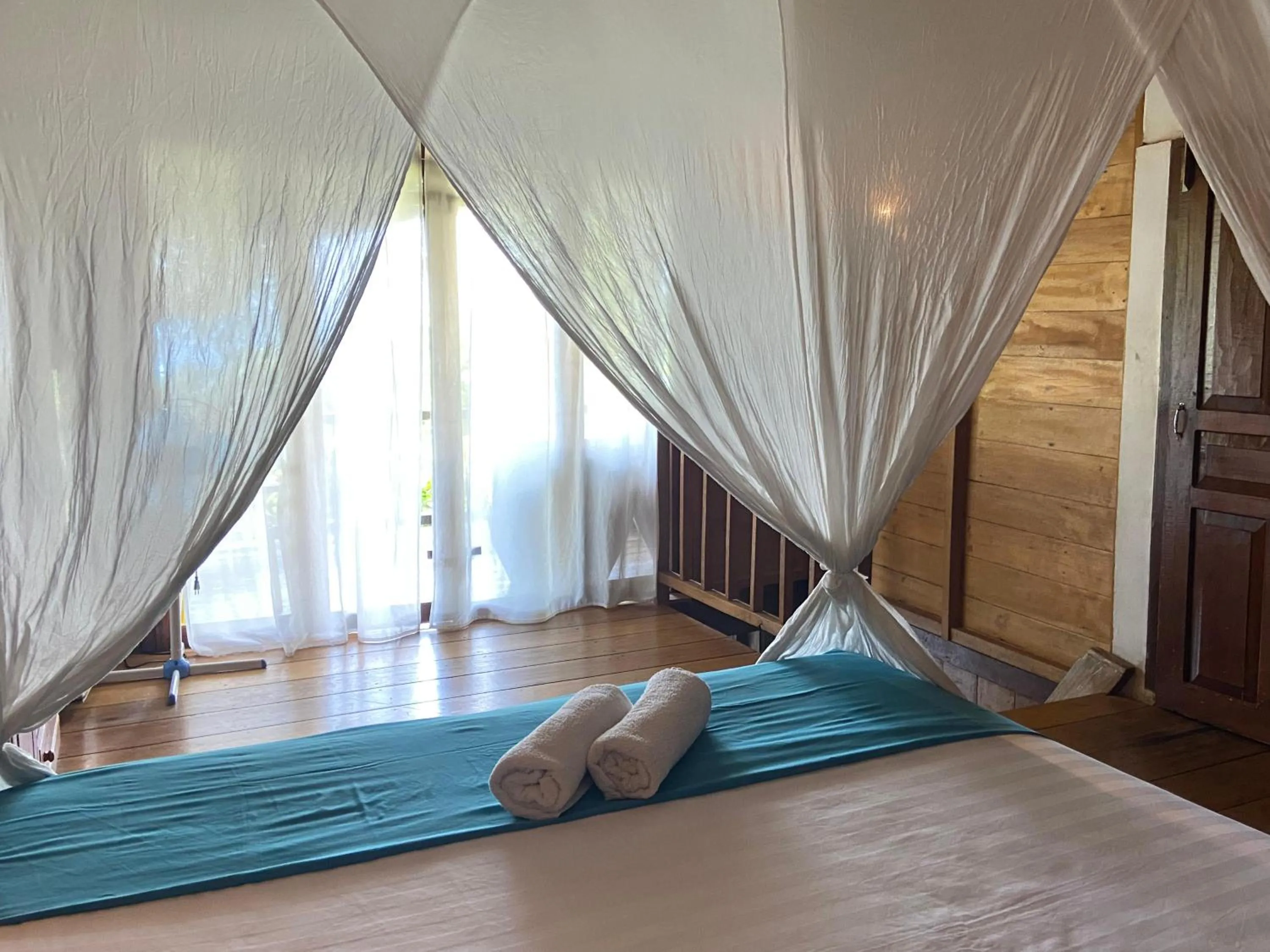 Bed in Casa Nemo Beach Resort & Spa