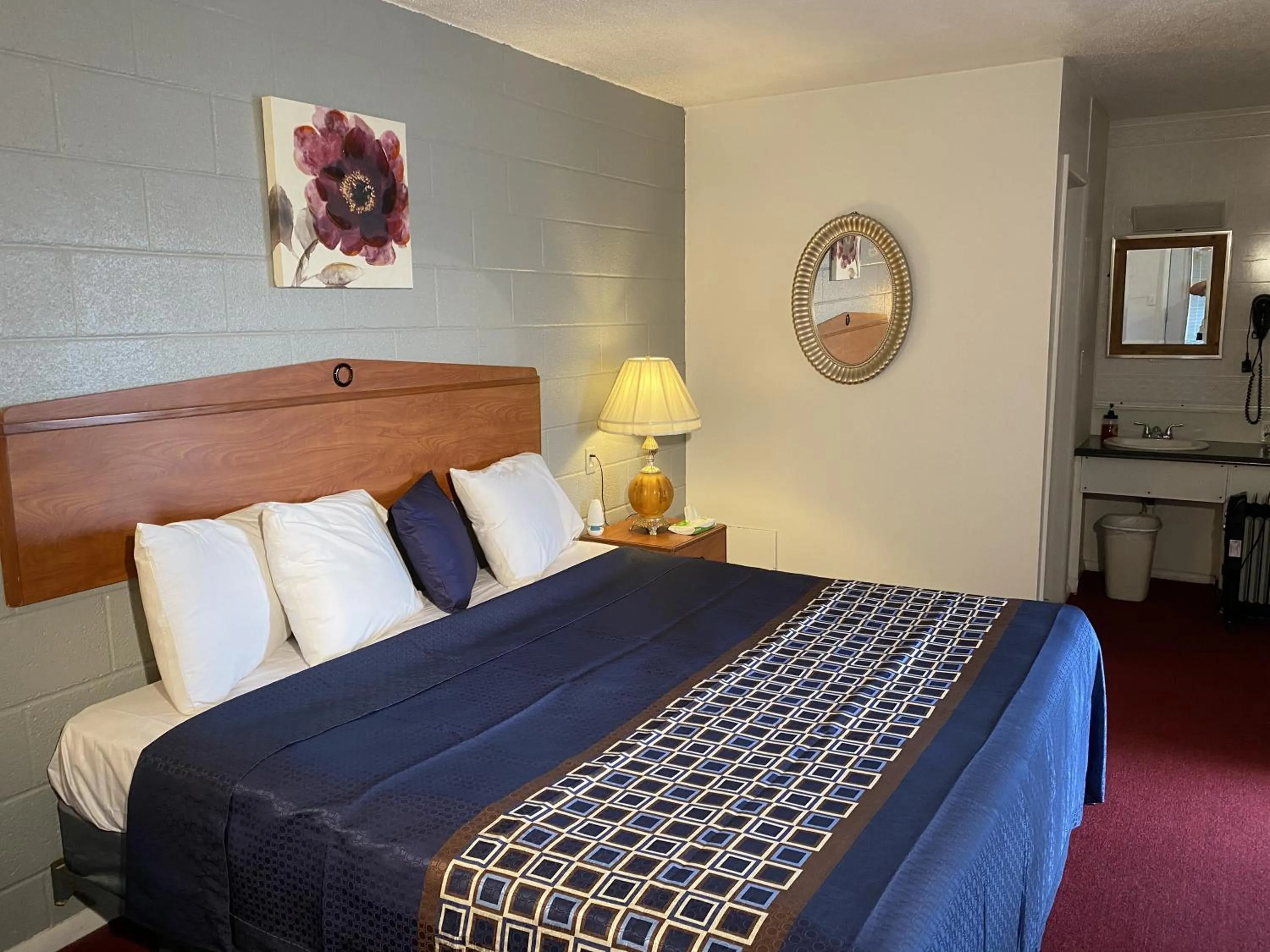 Bed in Knights Inn Fairview