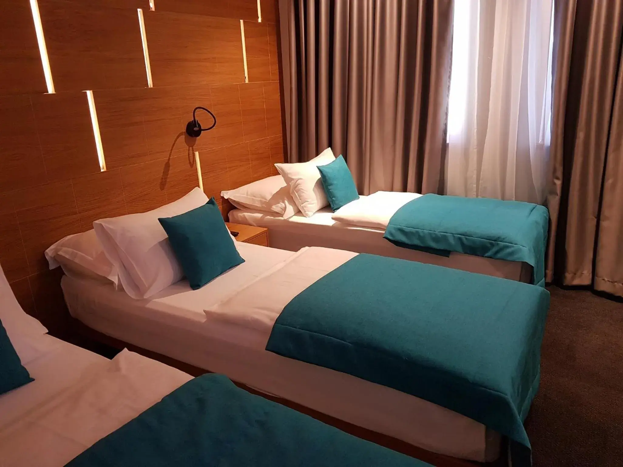 Deluxe Triple Room in Hotel Sana Deluxe Triple Room in Hotel Sana