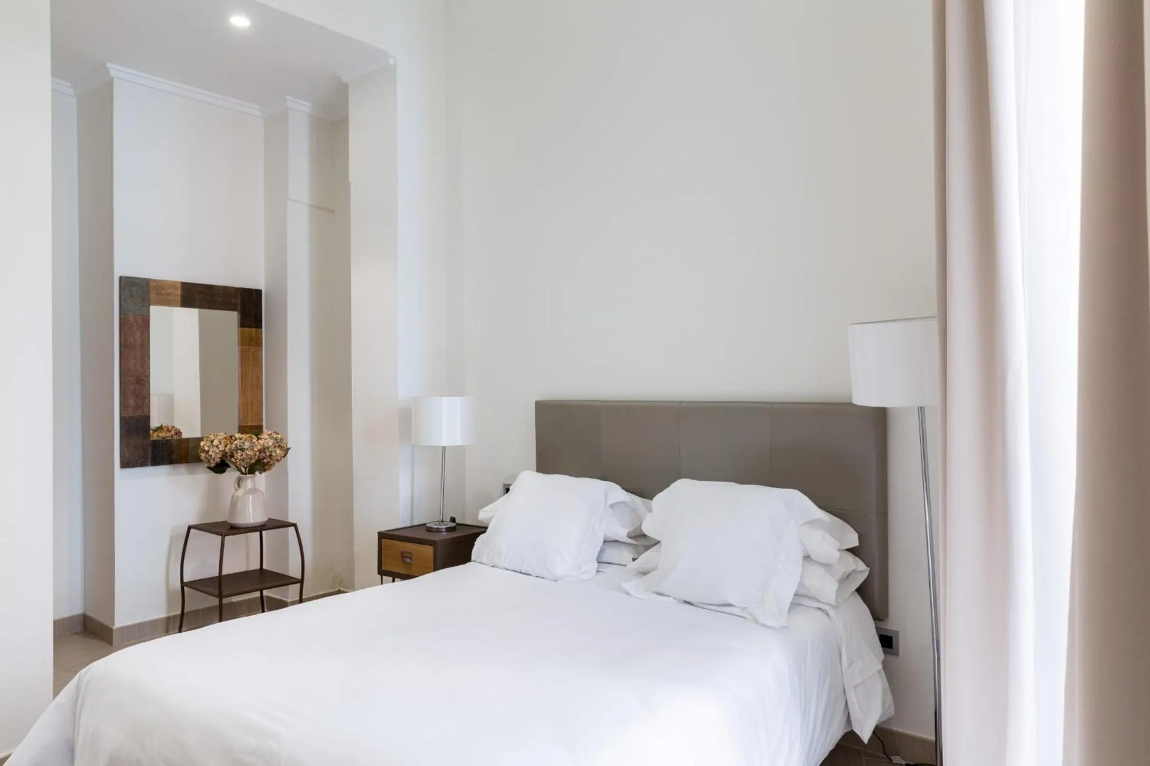 Bed in Welldone Cathedral Suites