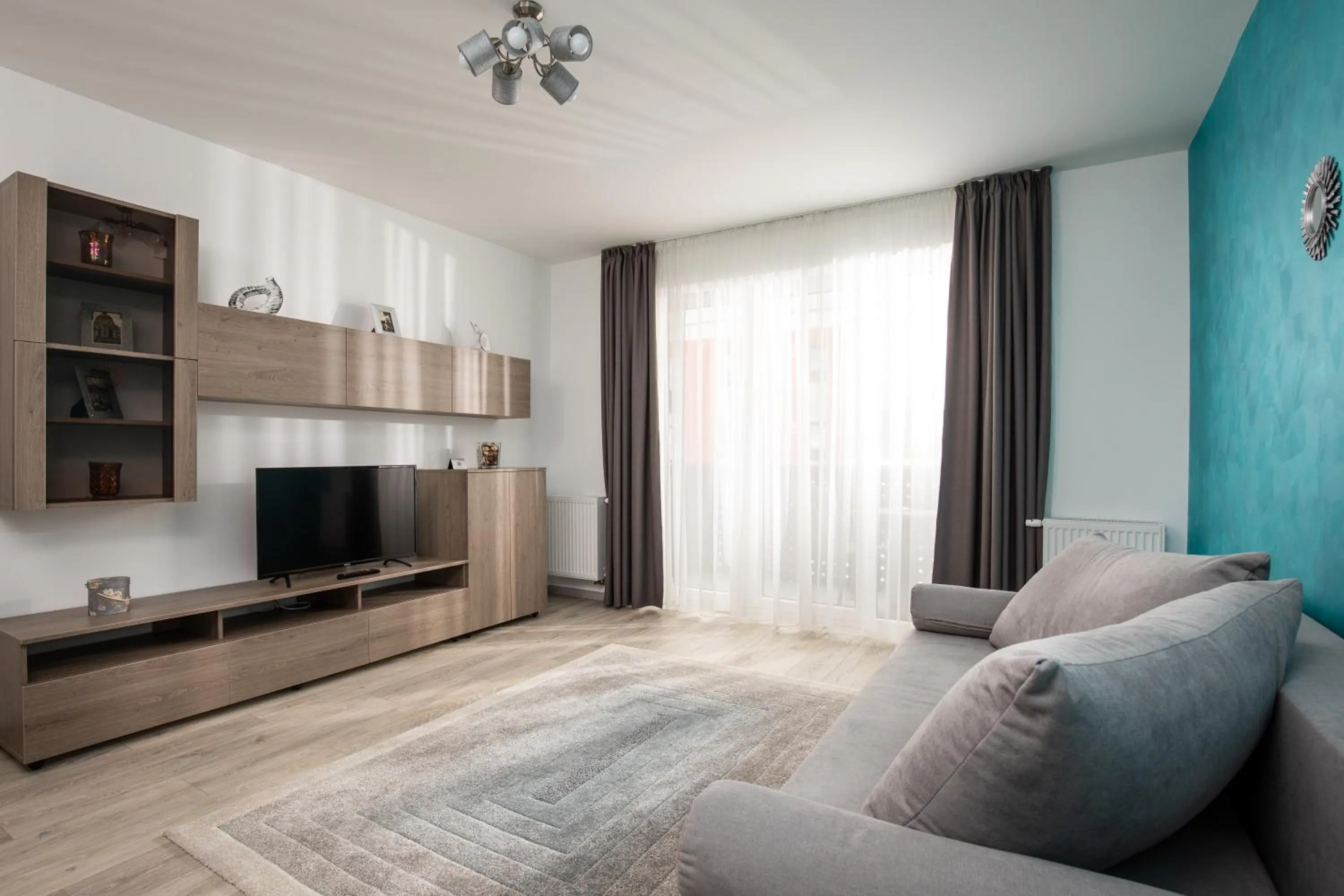 Communal lounge/ TV room in Brasov Holiday Apartments