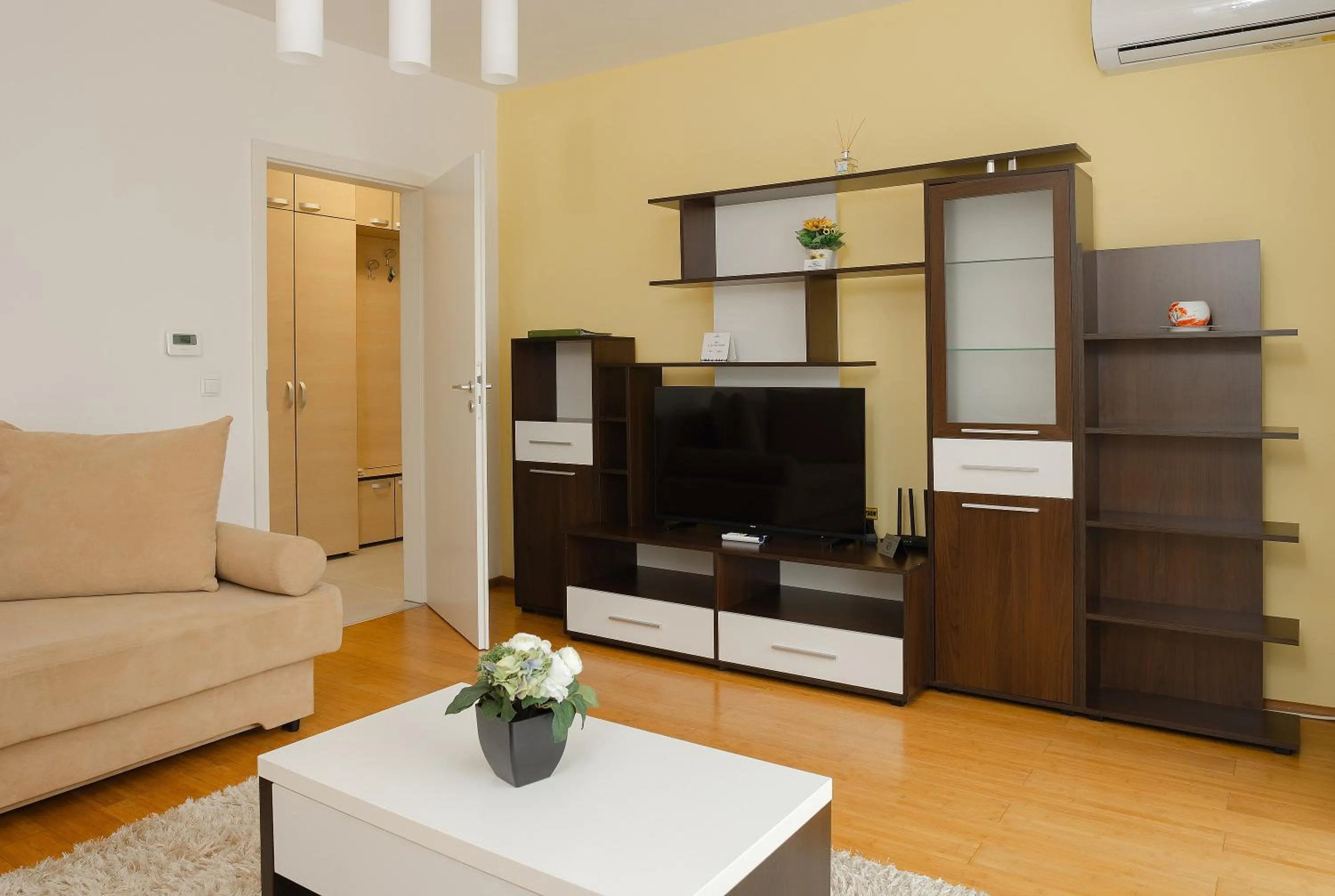 Communal lounge/ TV room in Brasov Holiday Apartments