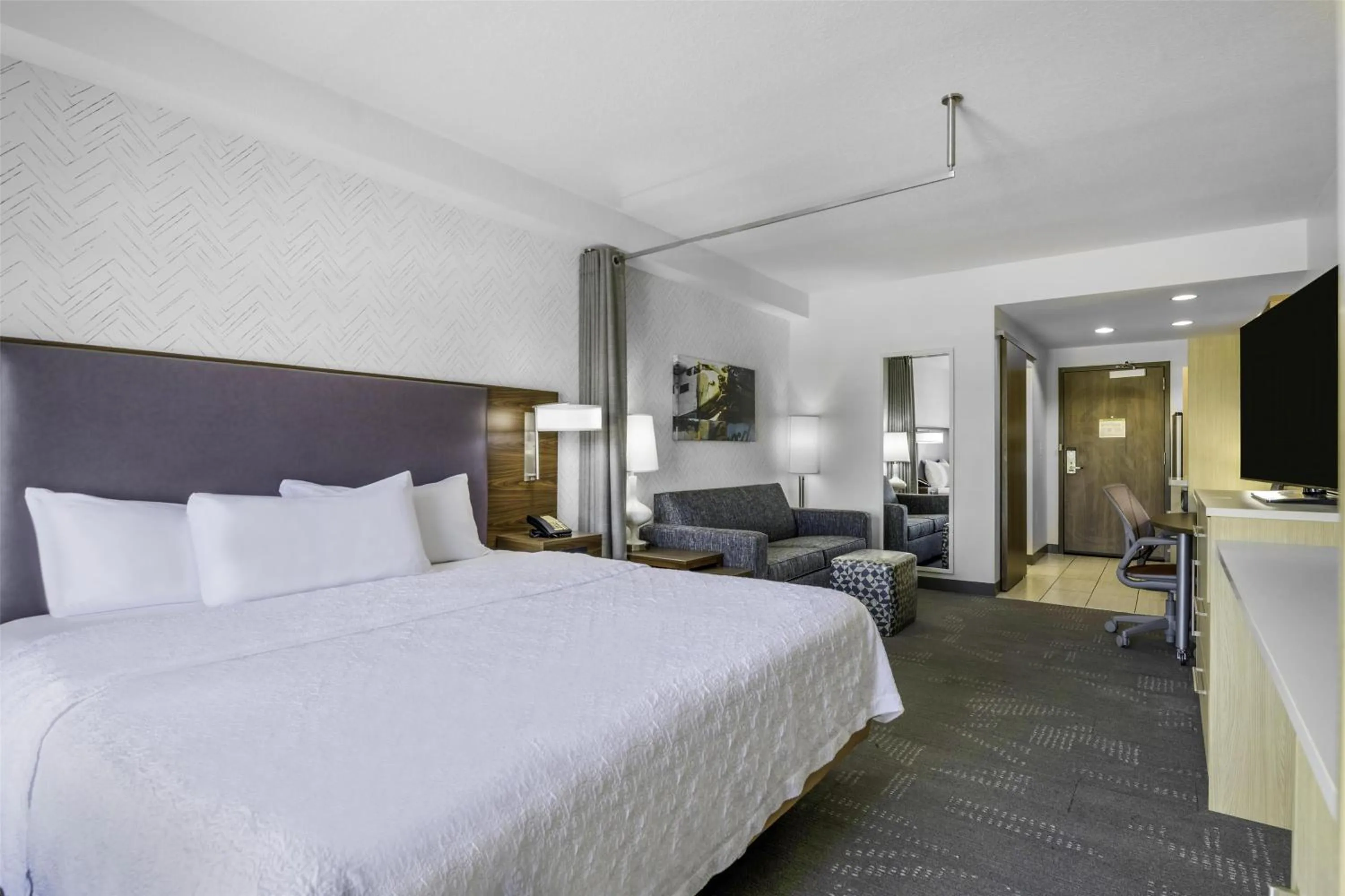 Living room, Bed in Home2 Suites By Hilton St. Simons Island