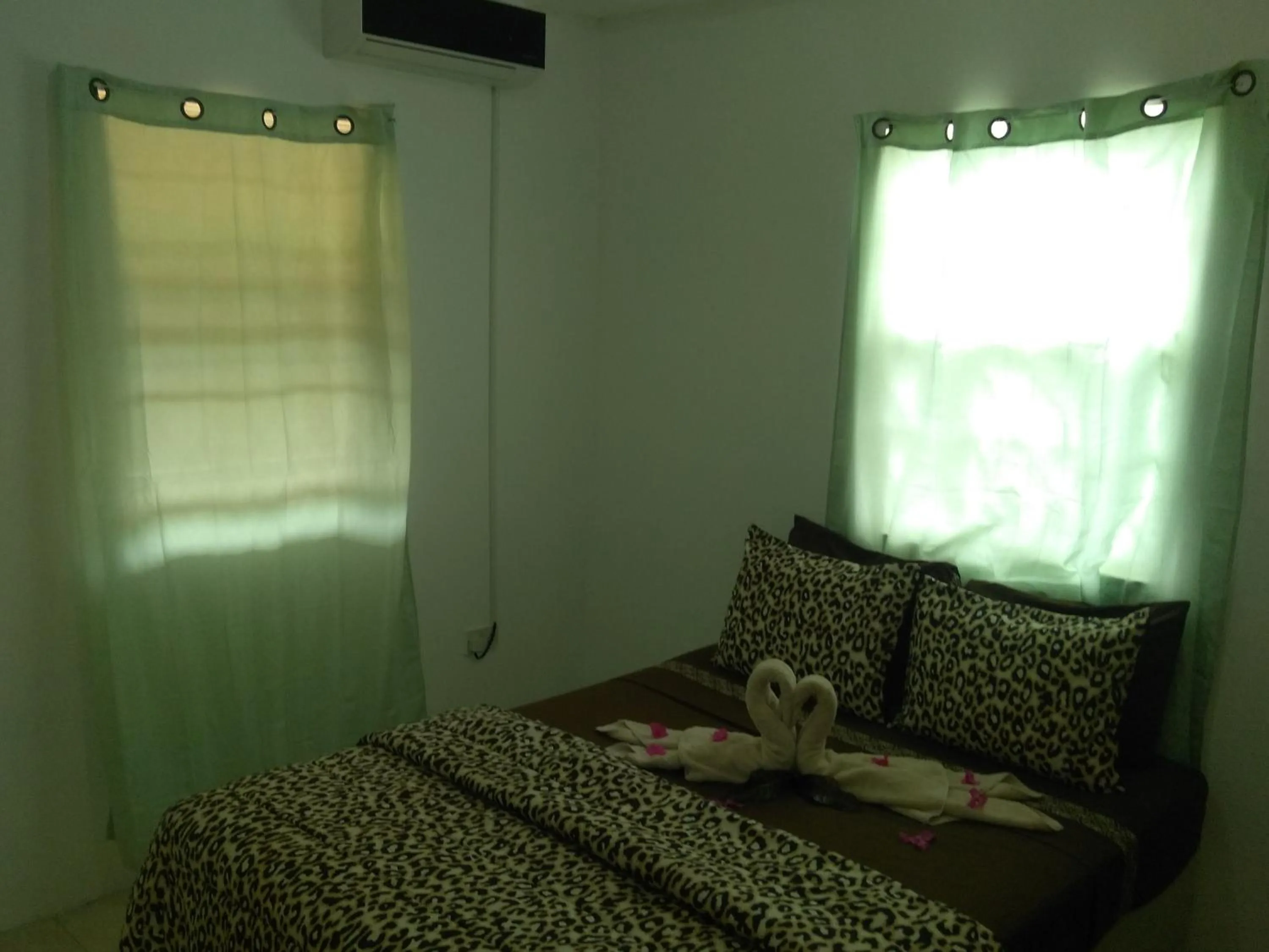 Bed in Caribbean Dream Vacation Property CD1