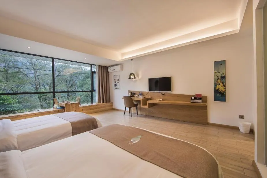 Photo of the whole room, Bed in Ancient Street No.5 Youth Chic Hotel