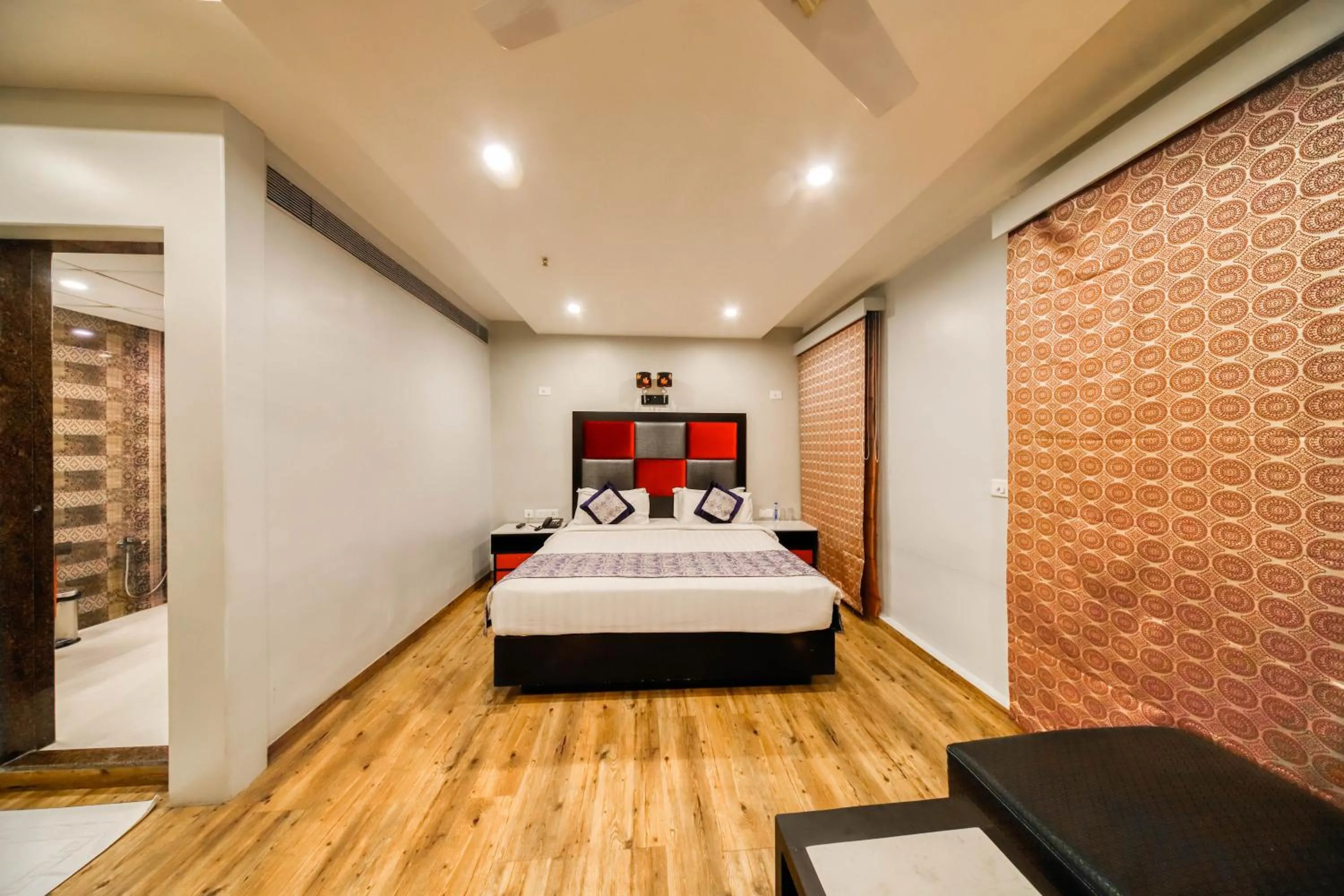 Bedroom, Bed in Regenta Inn Vadodara, 500m from Railway Station