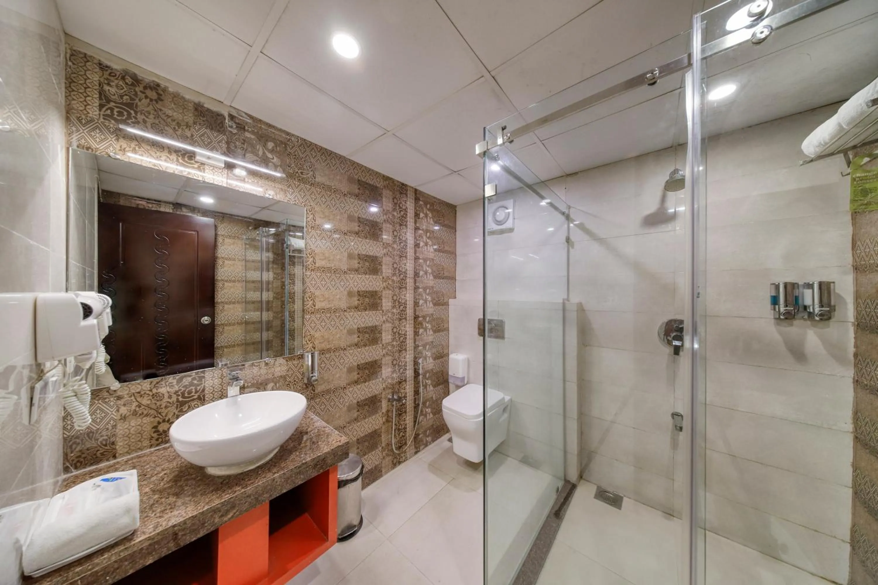 Bathroom in Regenta Inn Vadodara, 500m from Railway Station