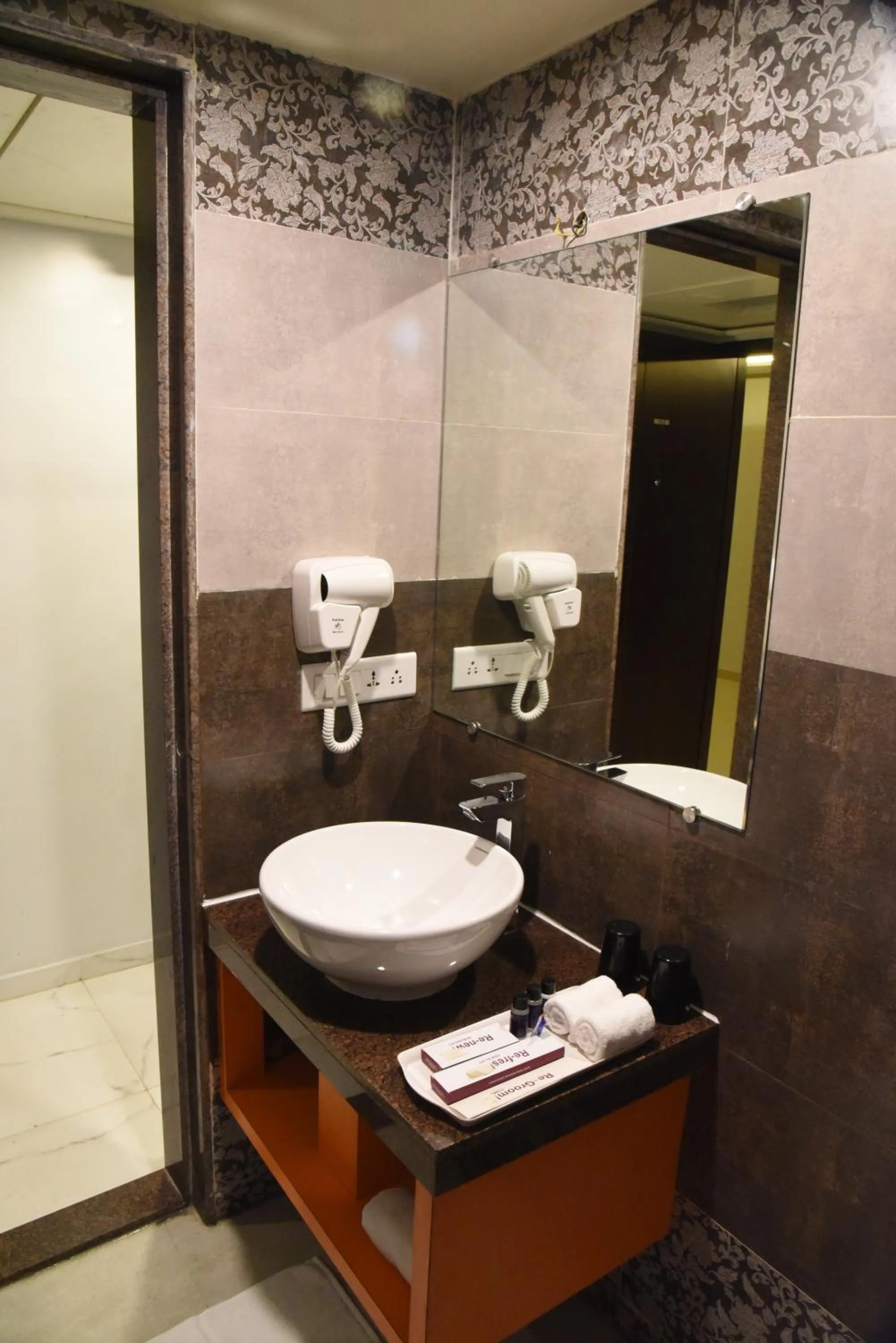 Bathroom in Regenta Inn Vadodara, 500m from Railway Station