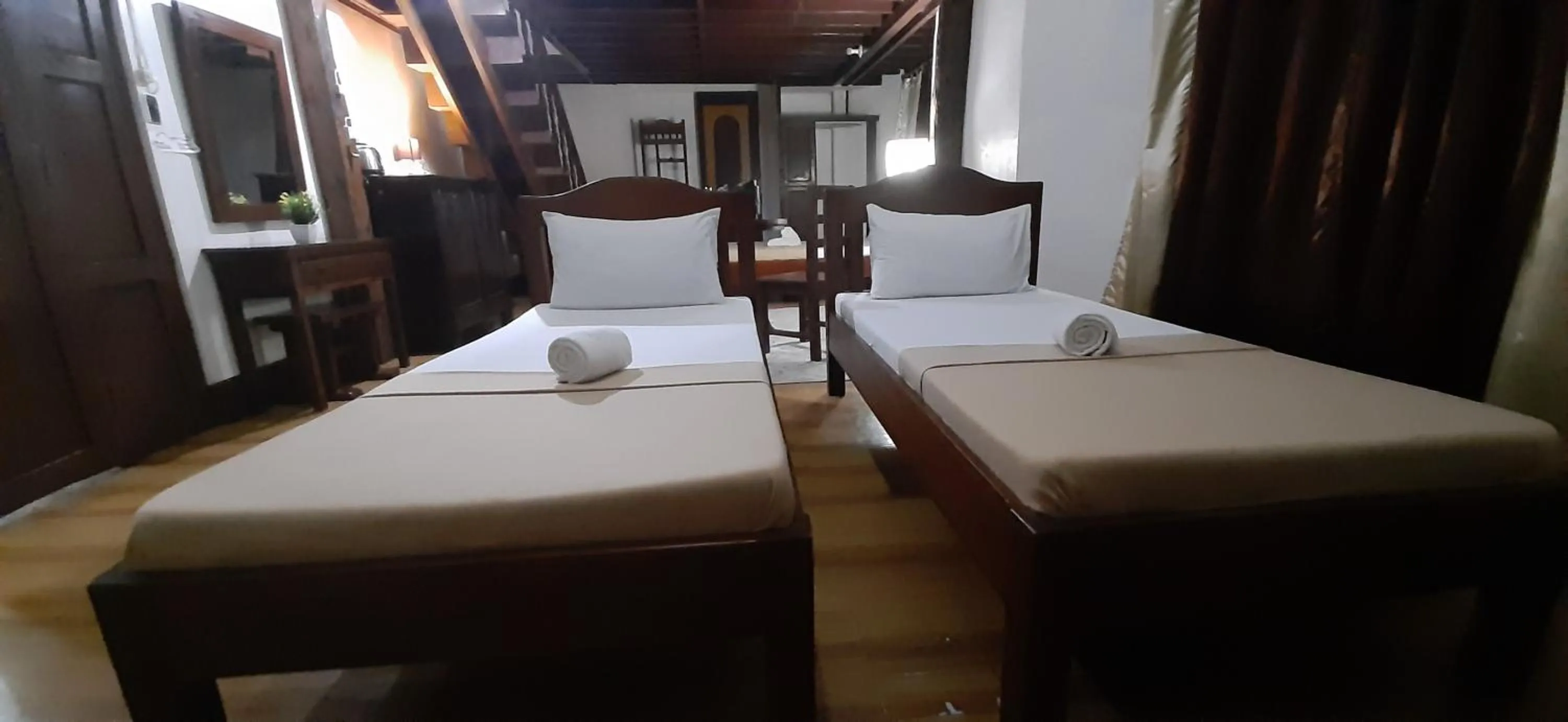 Bed in Escolta's Homey Lodge