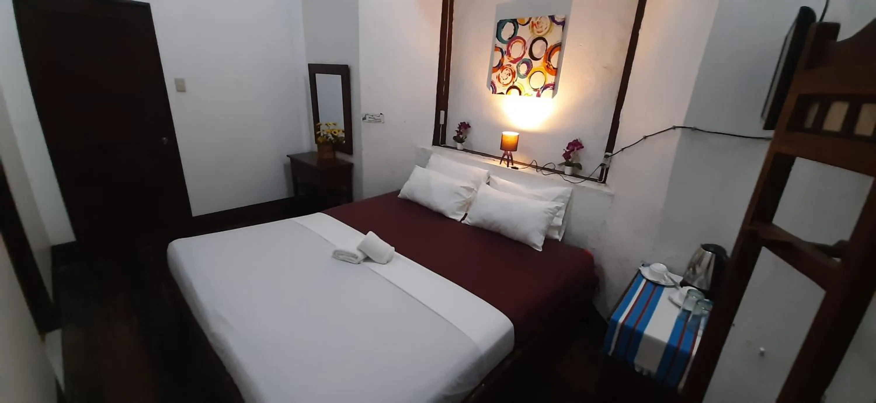 Bed in Escolta's Homey Lodge