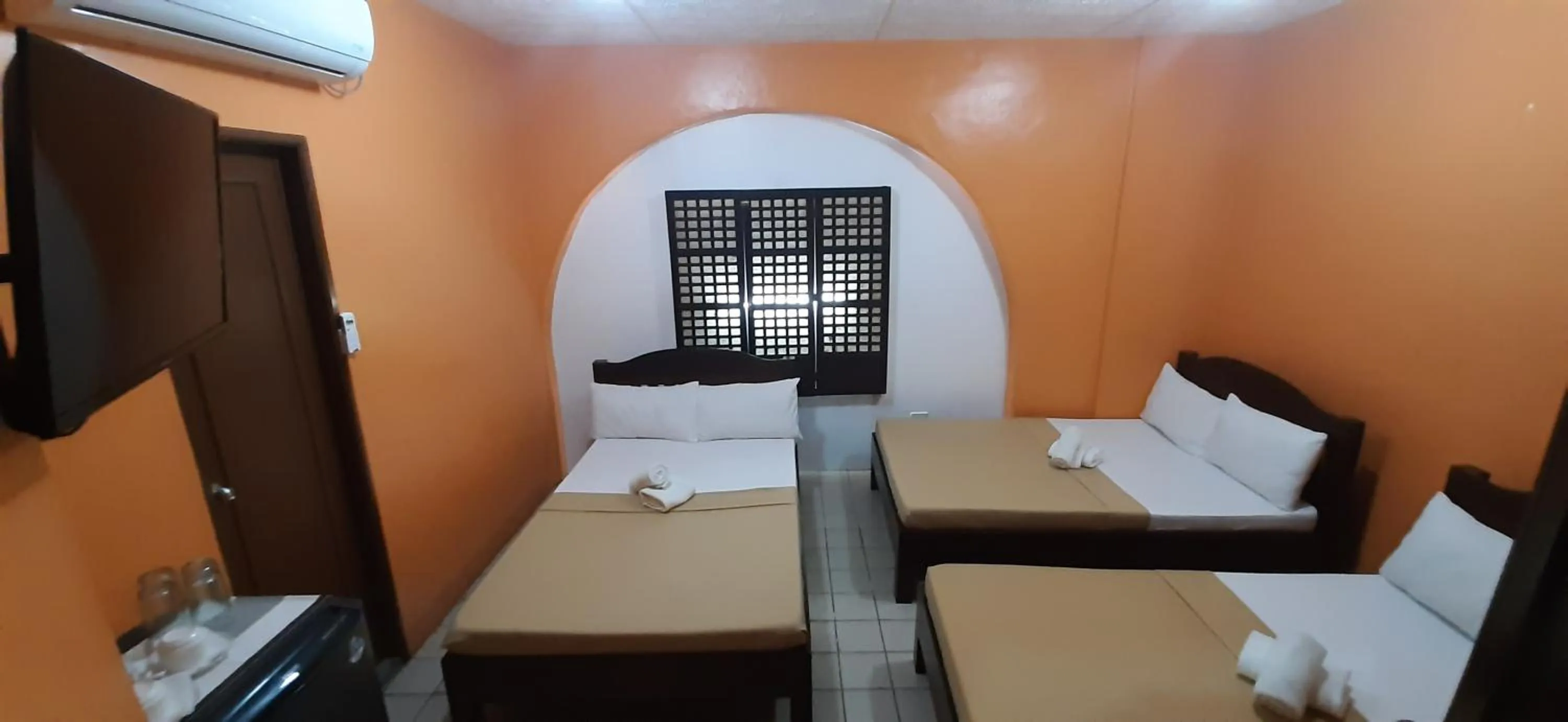 Bed in Escolta's Homey Lodge