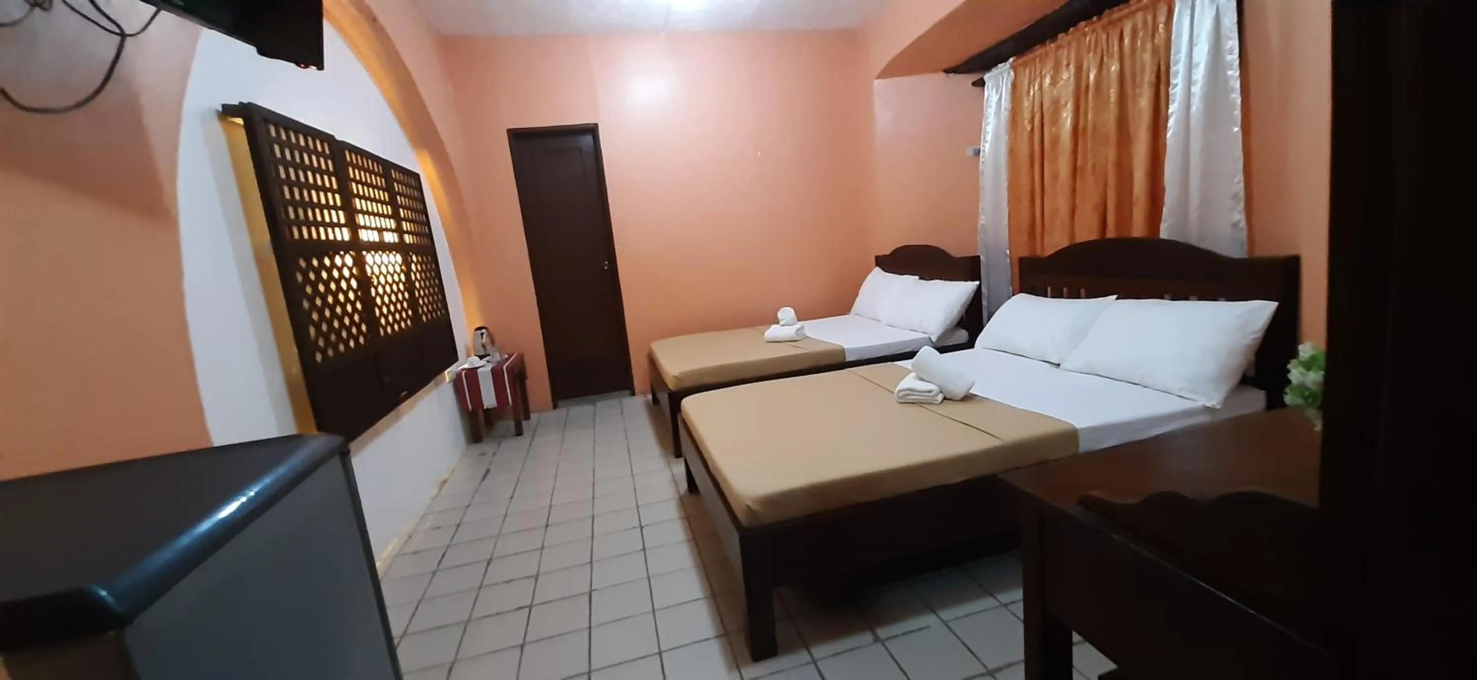 Bed in Escolta's Homey Lodge