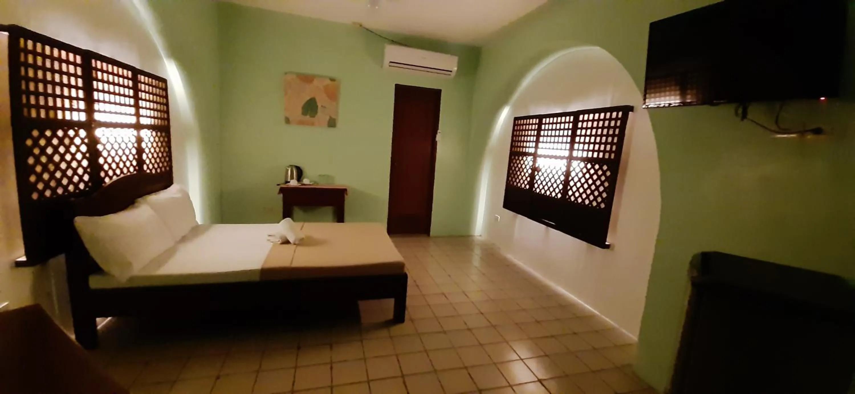 Bed in Escolta's Homey Lodge