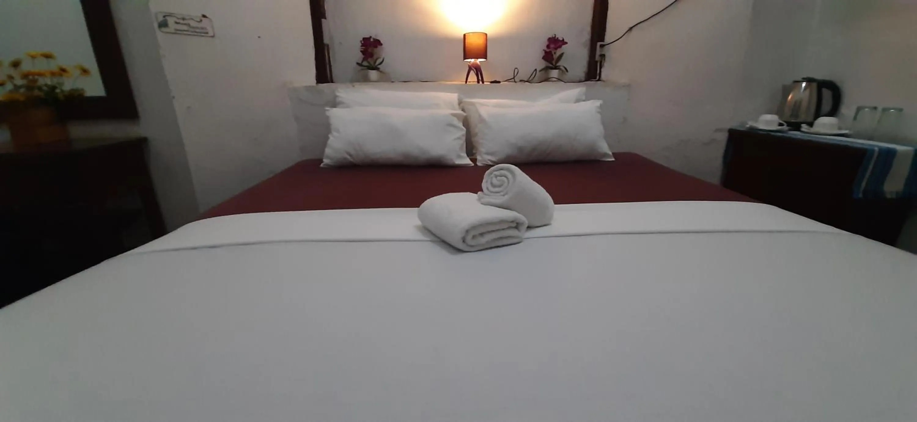 Bed in Escolta's Homey Lodge