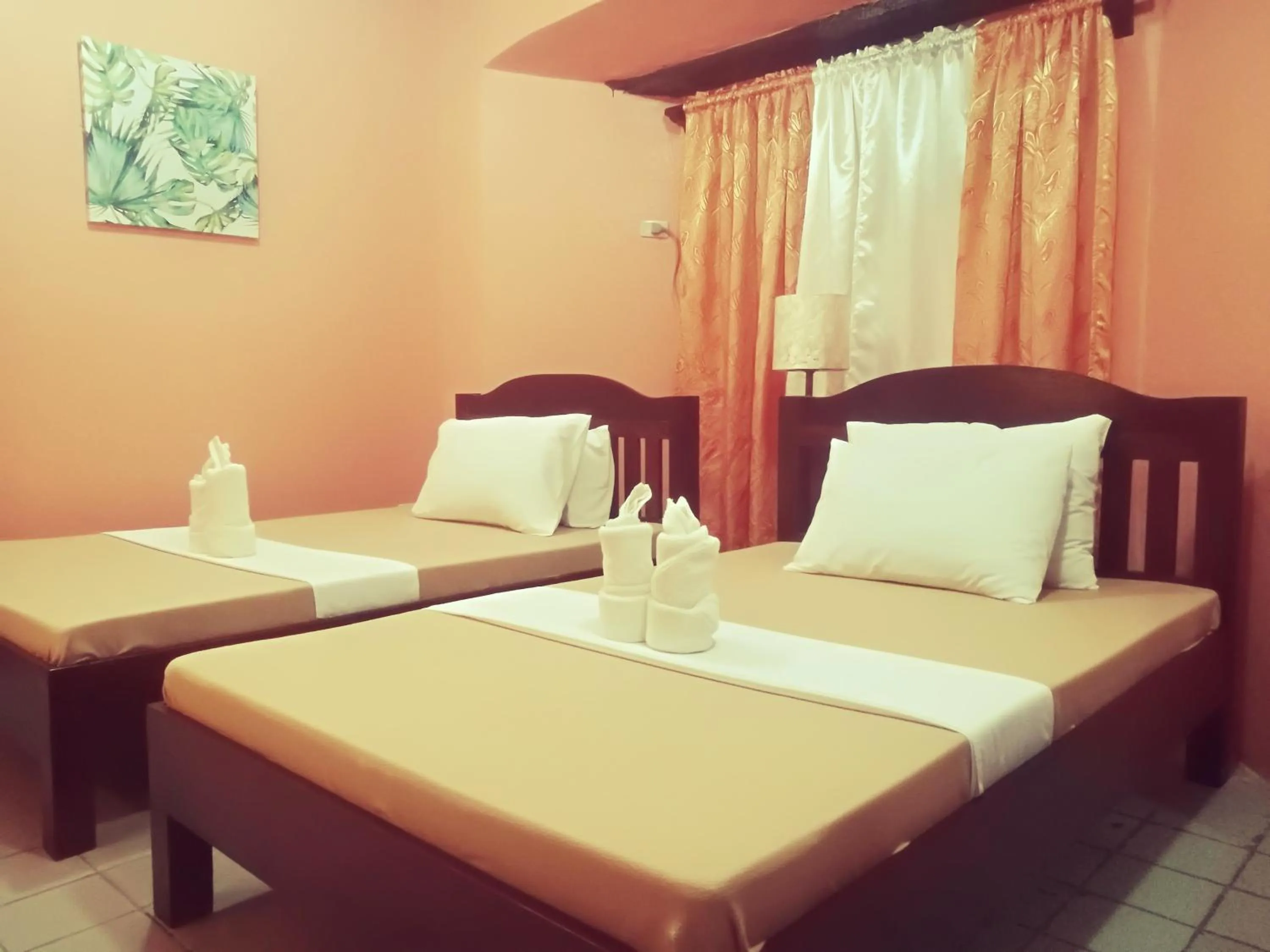 Bed in Escolta's Homey Lodge