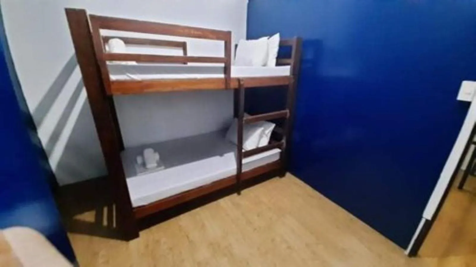 Bed in Escolta's Homey Lodge