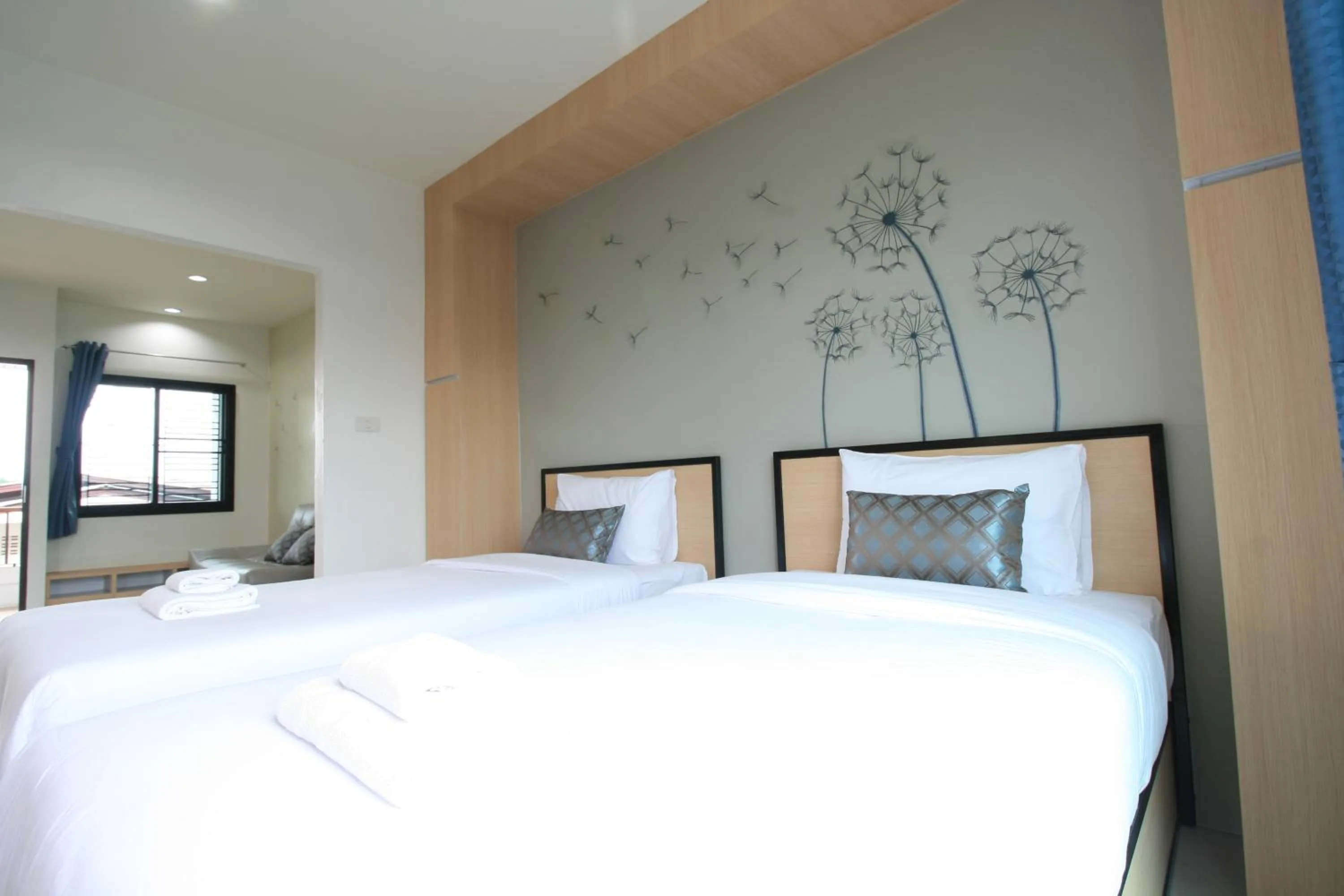 Living room, Bed in Sirimunta Hotel Chiang Rai Suite & Residence