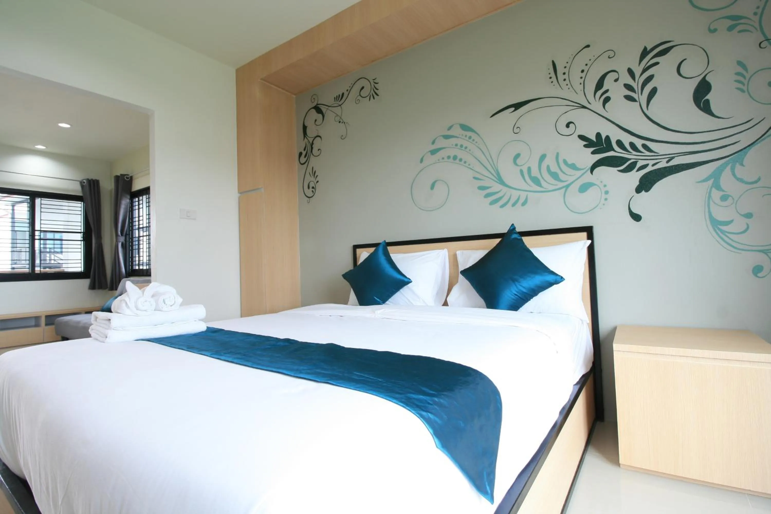 Photo of the whole room, Bed in Sirimunta Hotel Chiang Rai Suite & Residence