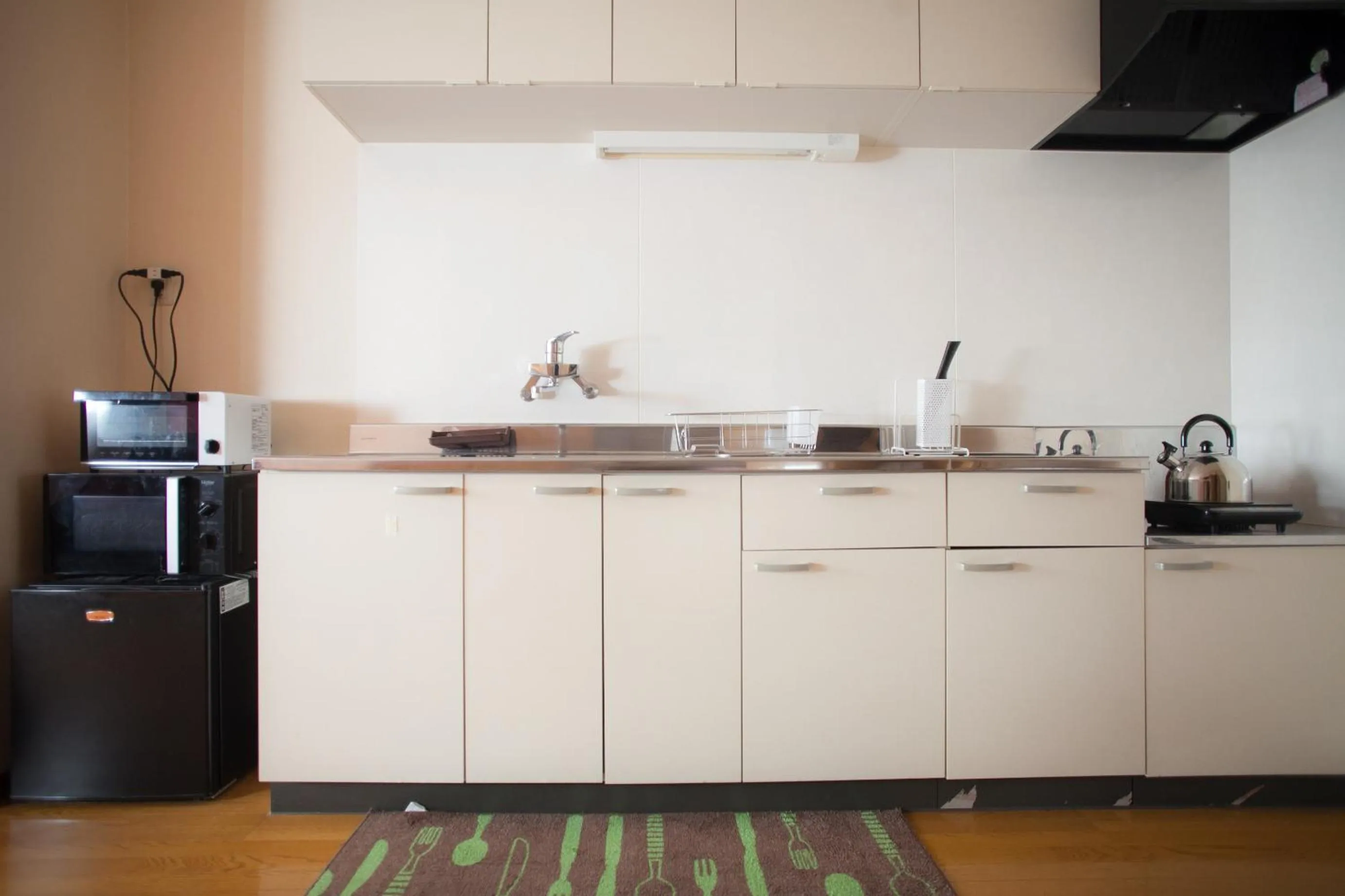 Kitchen or kitchenette in Riverside 旅音