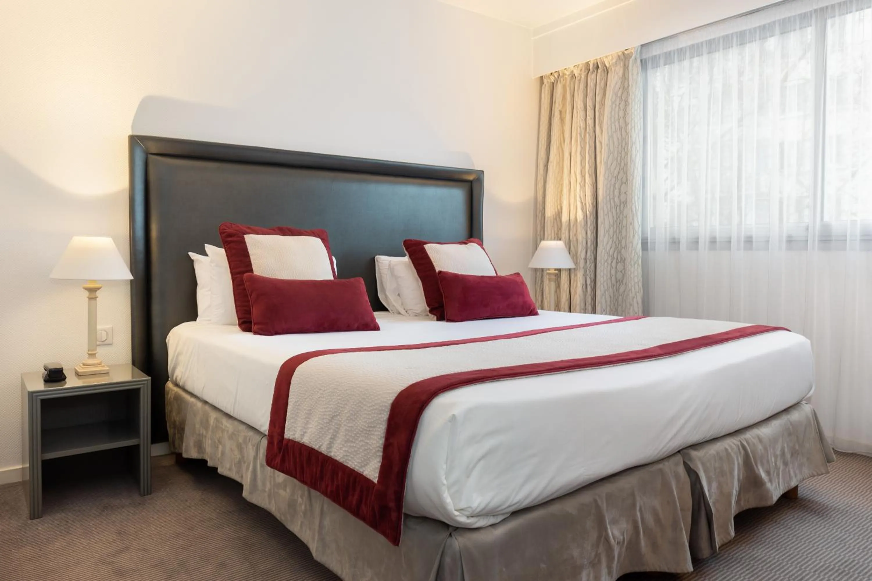 Bed in Hôtel Charlemagne by Happyculture