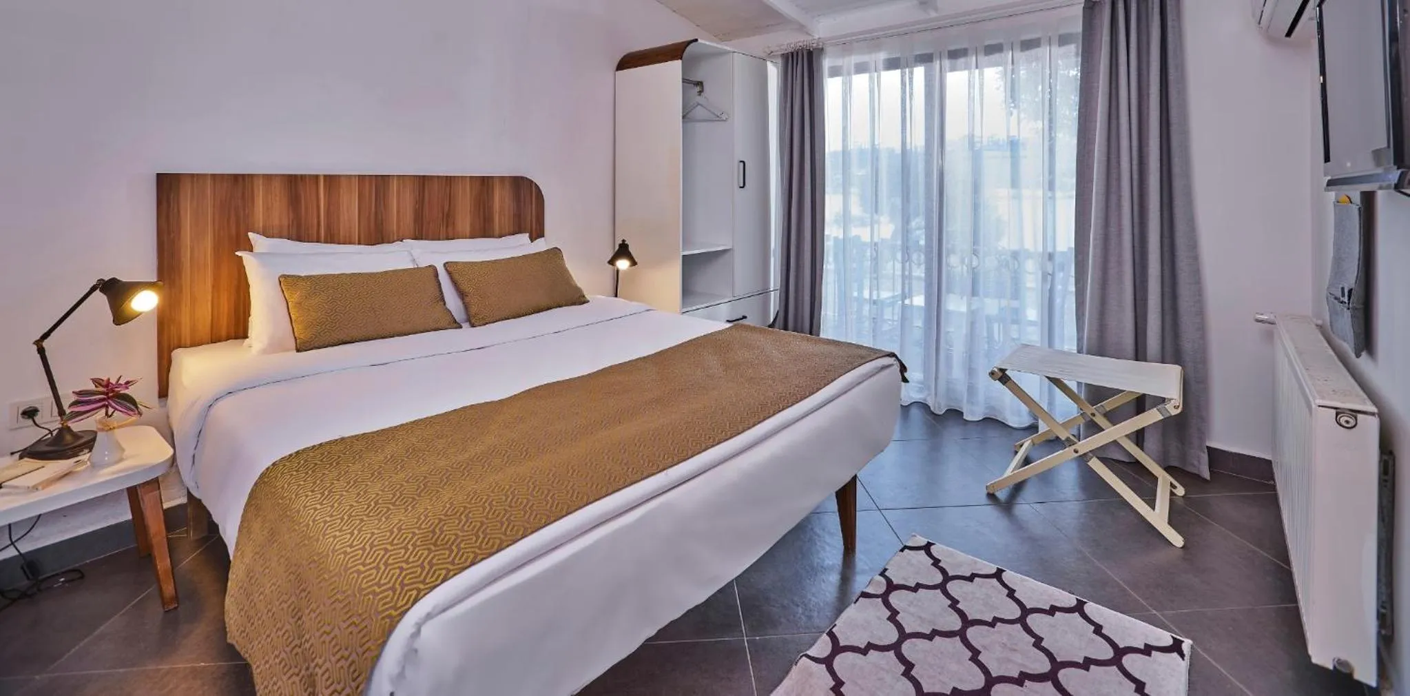 Bed in Maya Bistro Hotel & Beach