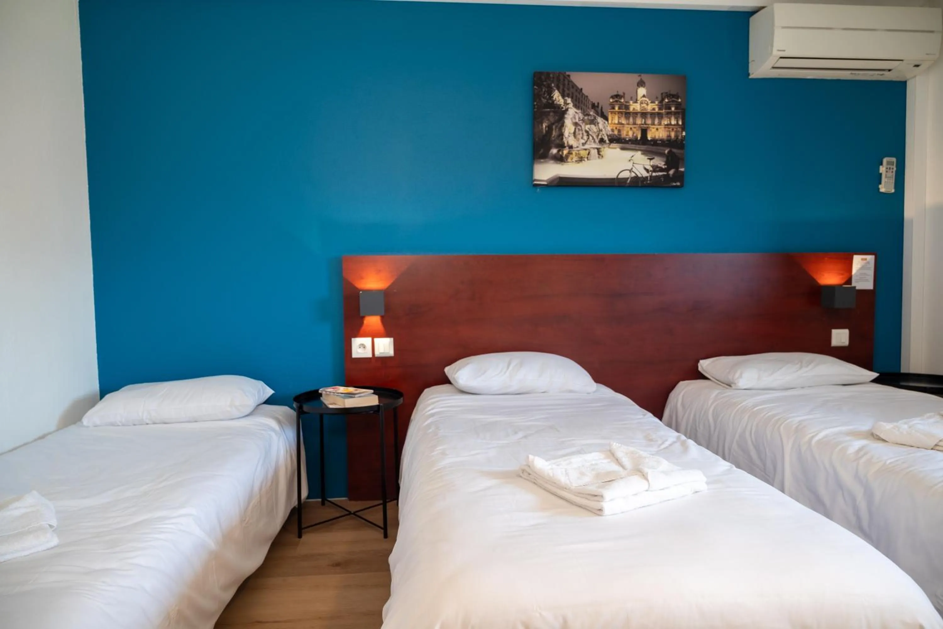 Bed in Initial by Balladins Lyon Villefranche-sur-Saône