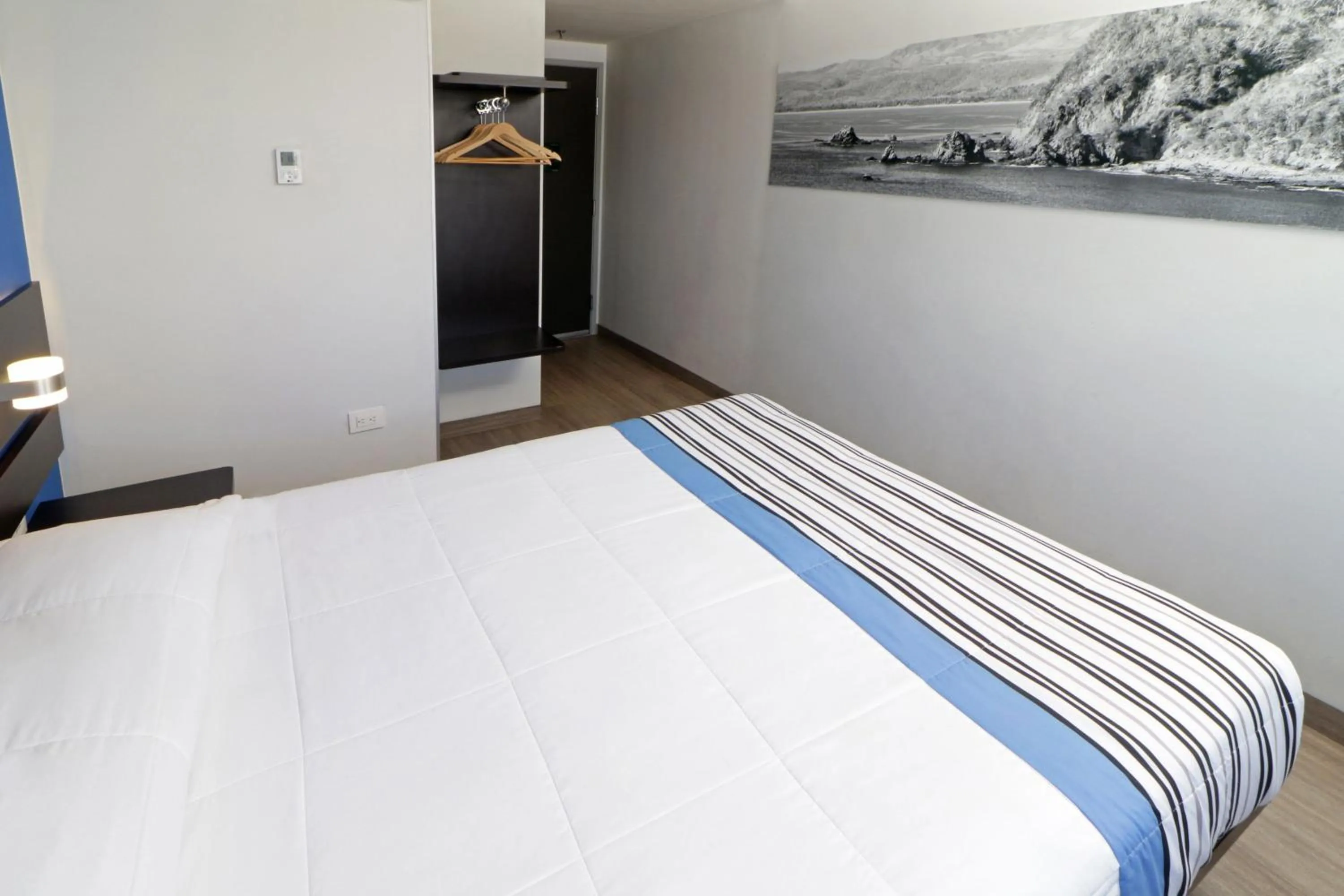 Bedroom, Bed in City Express Junior by Marriott Merida Altabrisa