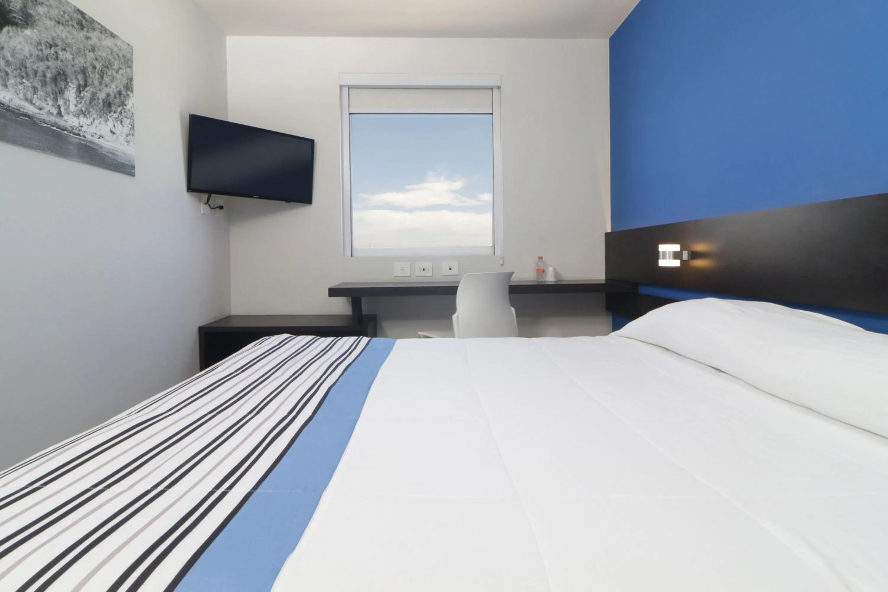 Bedroom, Bed in City Express Junior by Marriott Merida Altabrisa
