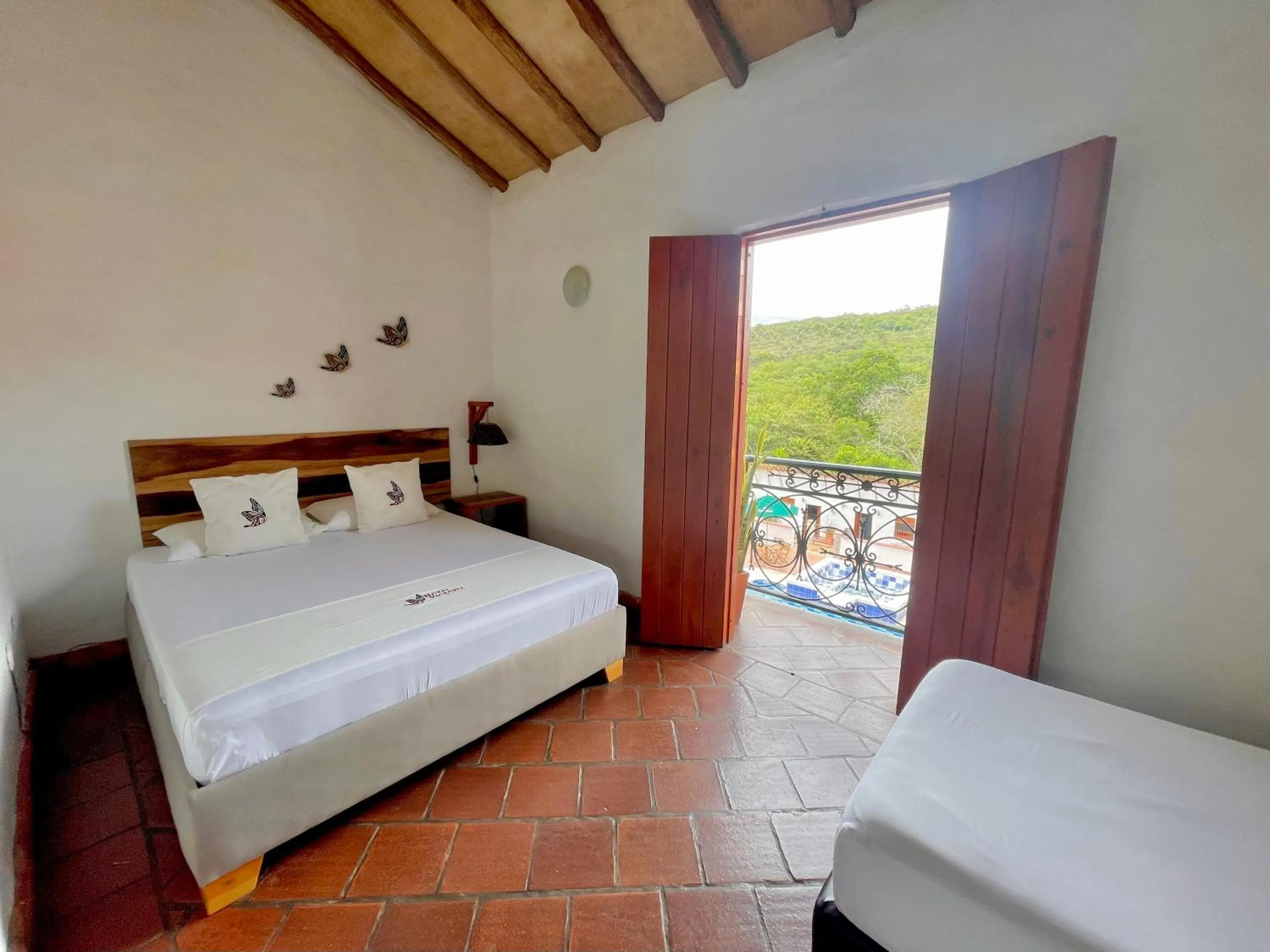 View (from property/room), Bed in Hotel Victoria Barichara