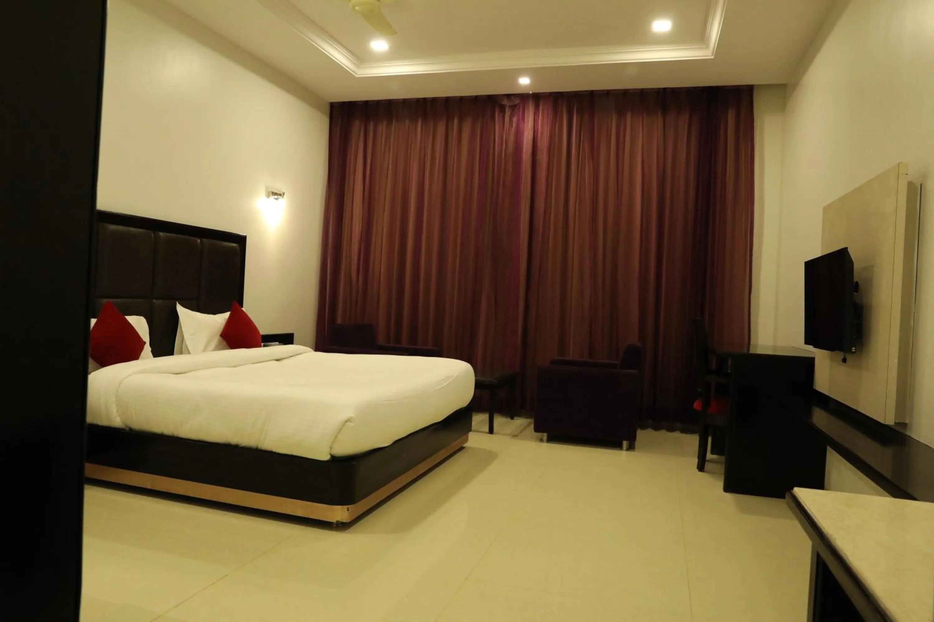 Photo of the whole room, Bed in Chandra Grand