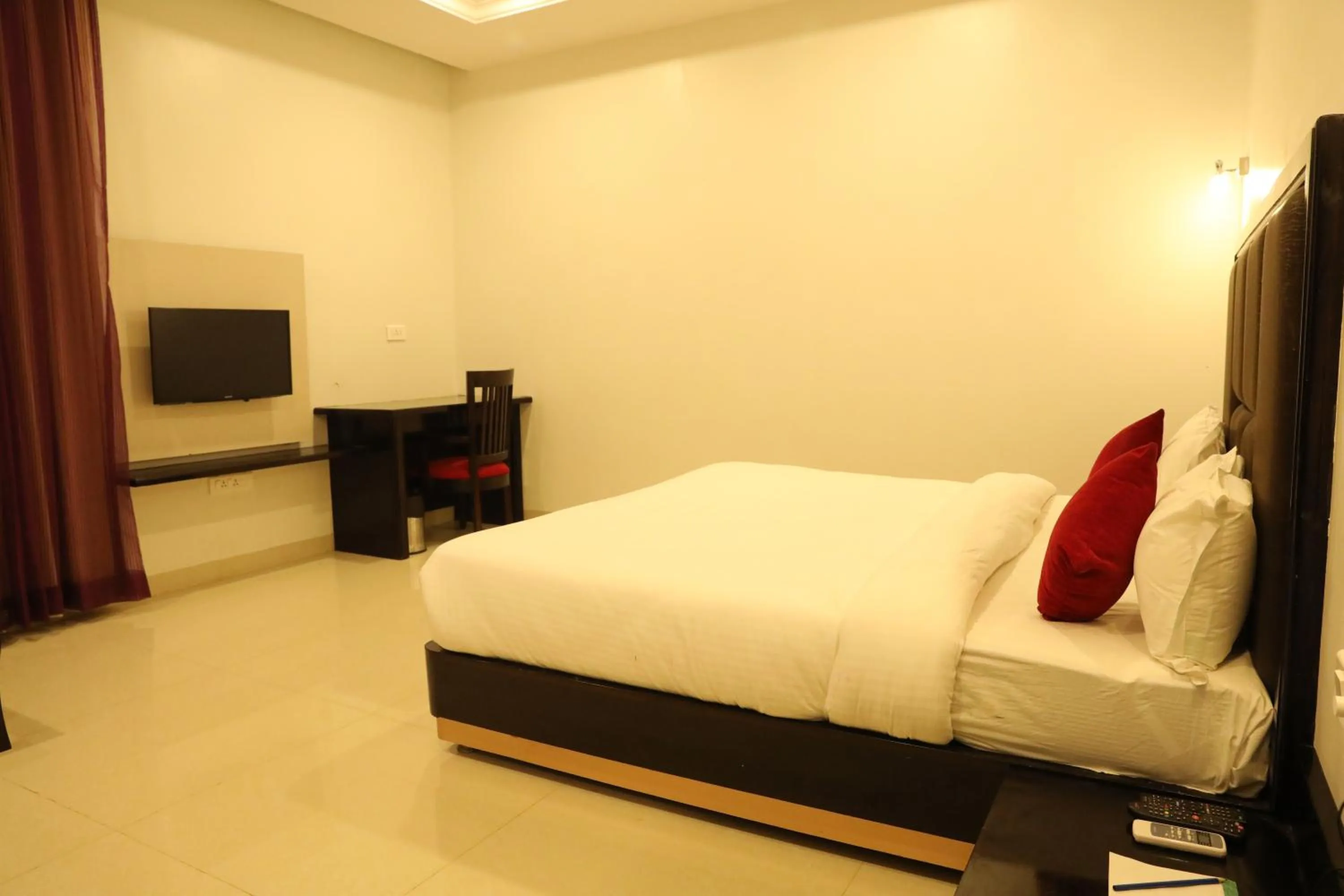 Photo of the whole room, Bed in Chandra Grand