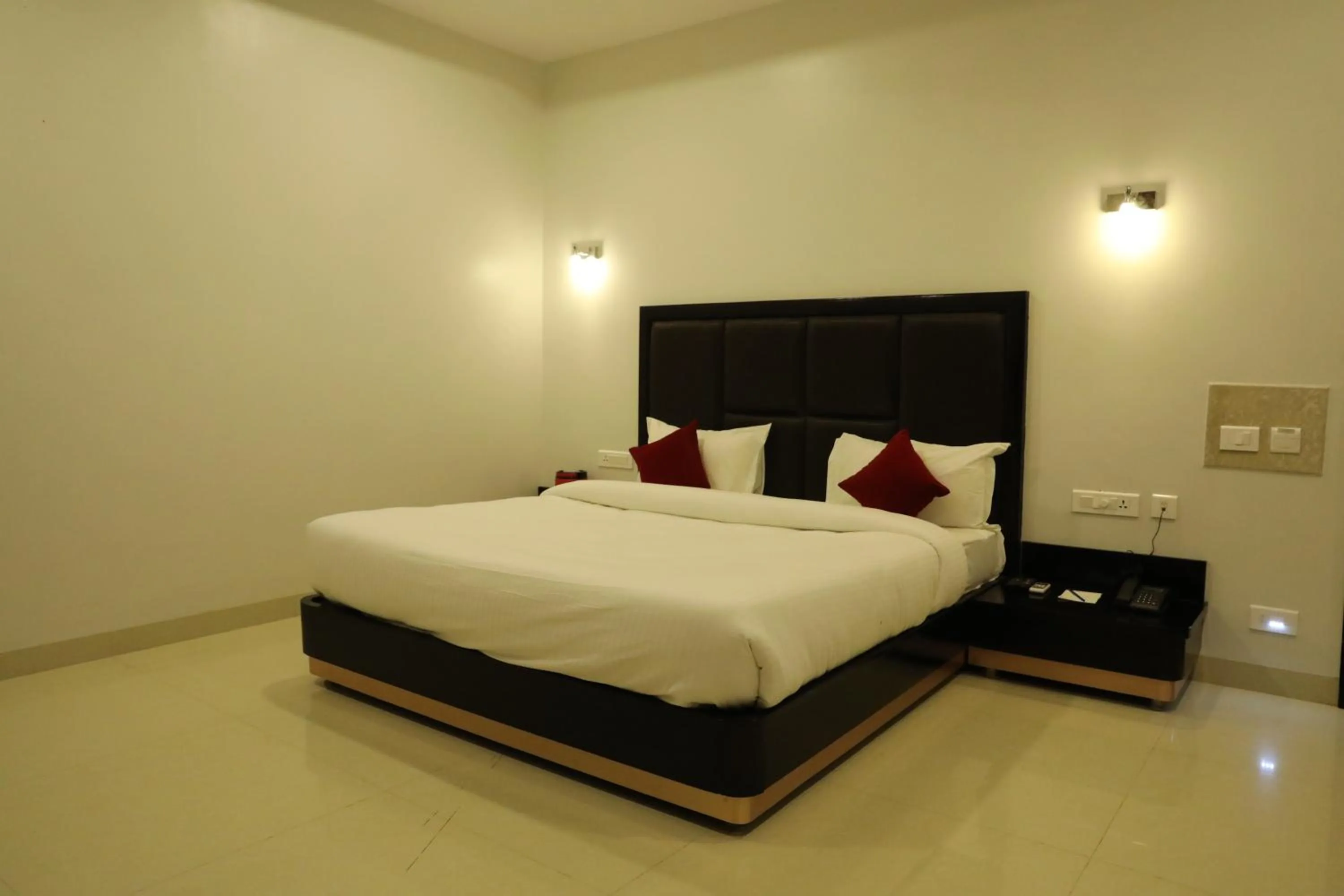 Photo of the whole room, Bed in Chandra Grand