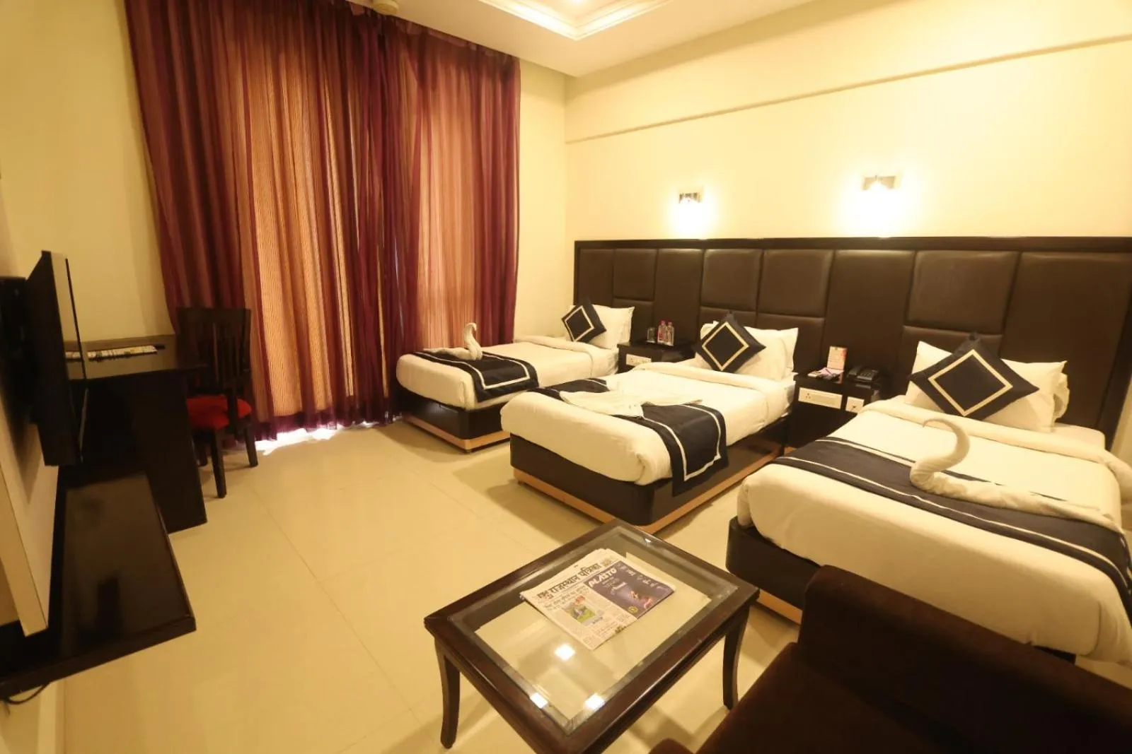 Photo of the whole room, Bed in Chandra Grand