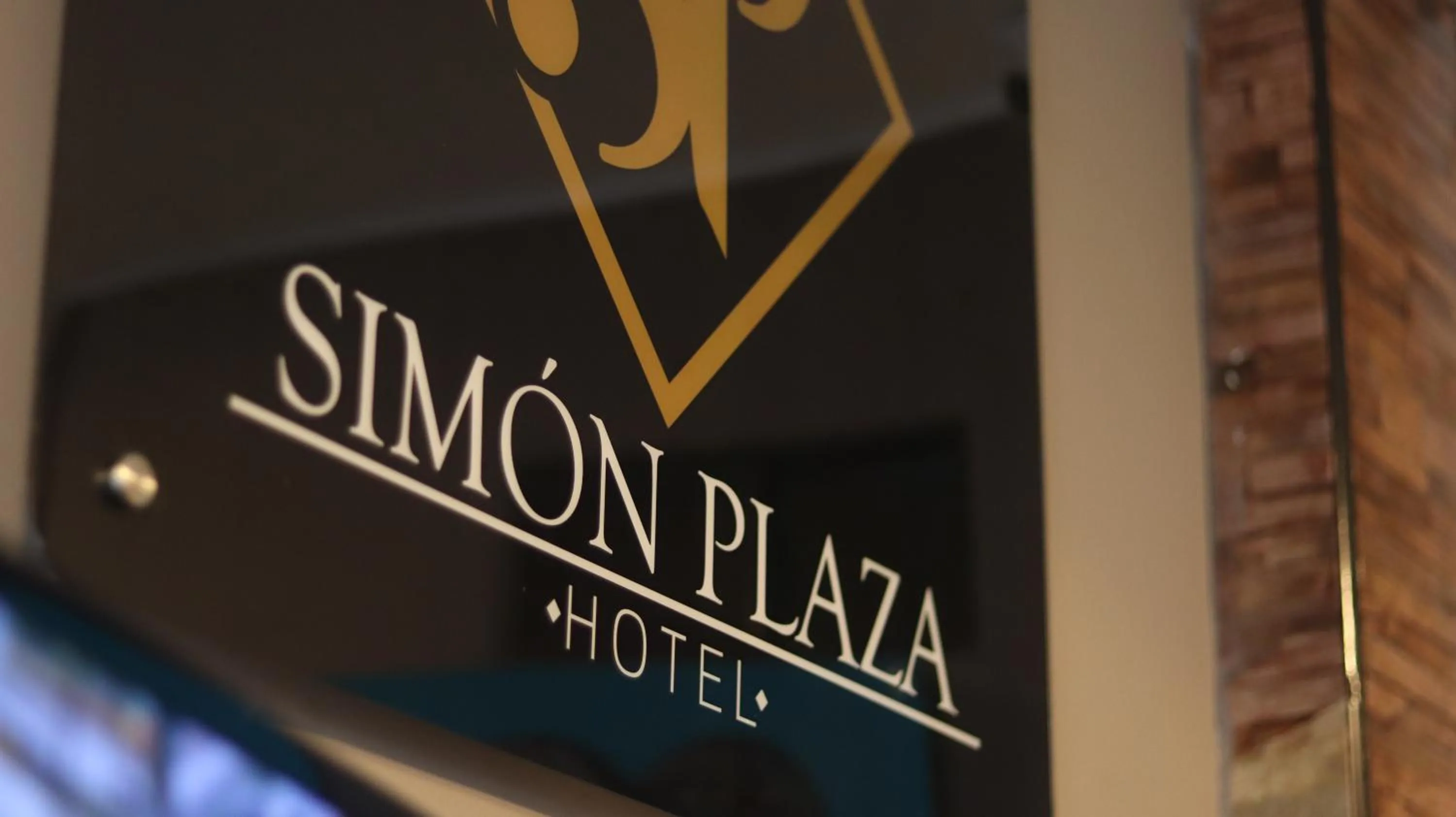 Property logo or sign in Hotel Simón Plaza